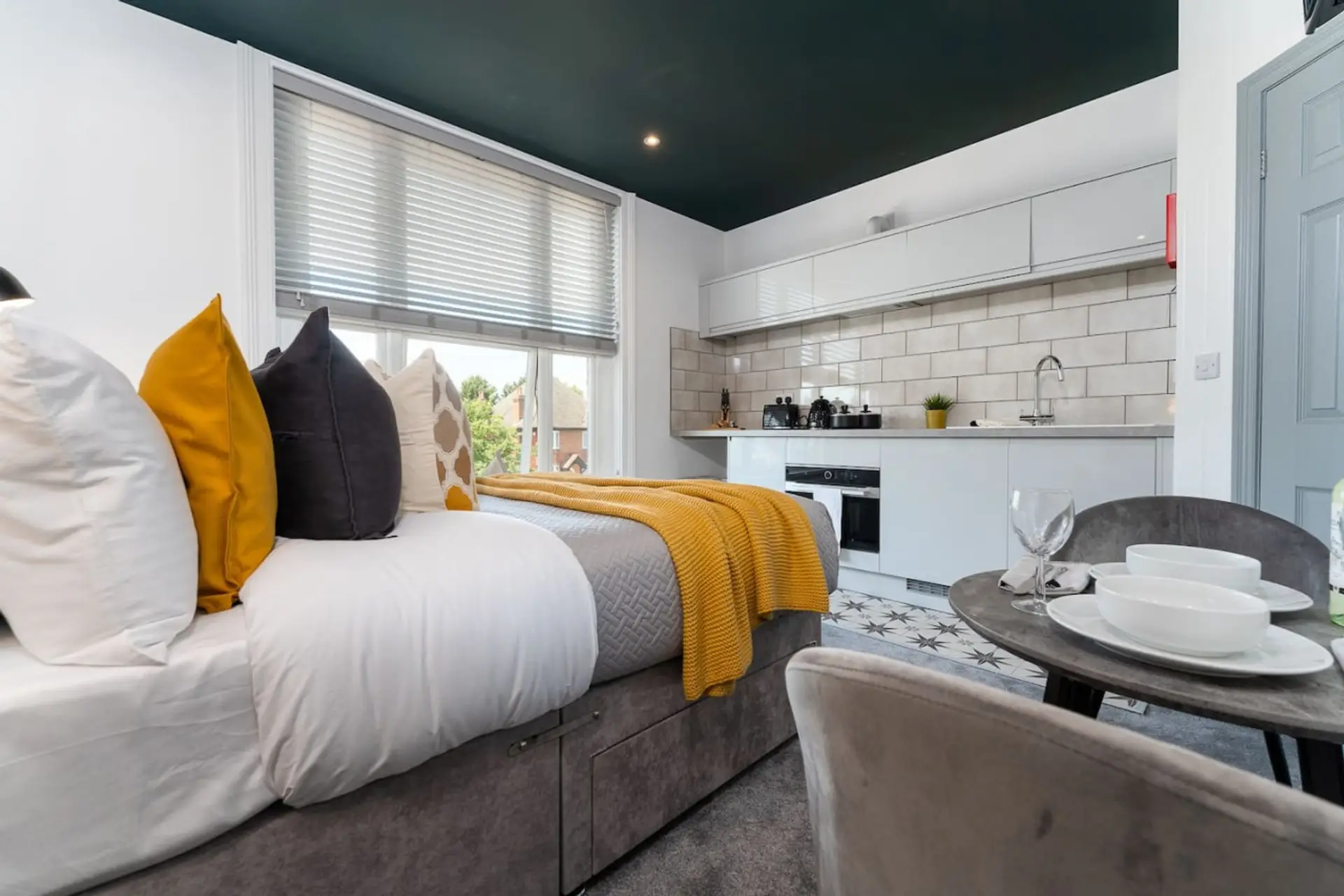 Studio apartment with full kitchen and seating space