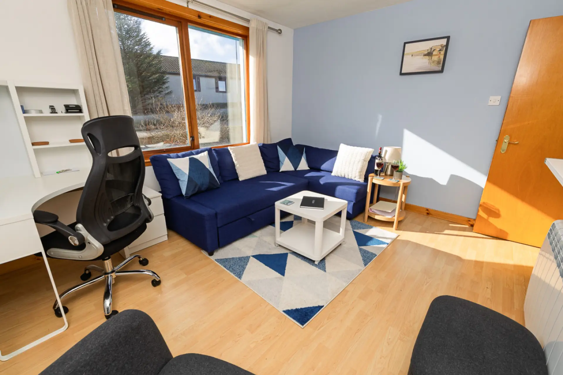 Living area with sofa and workspace