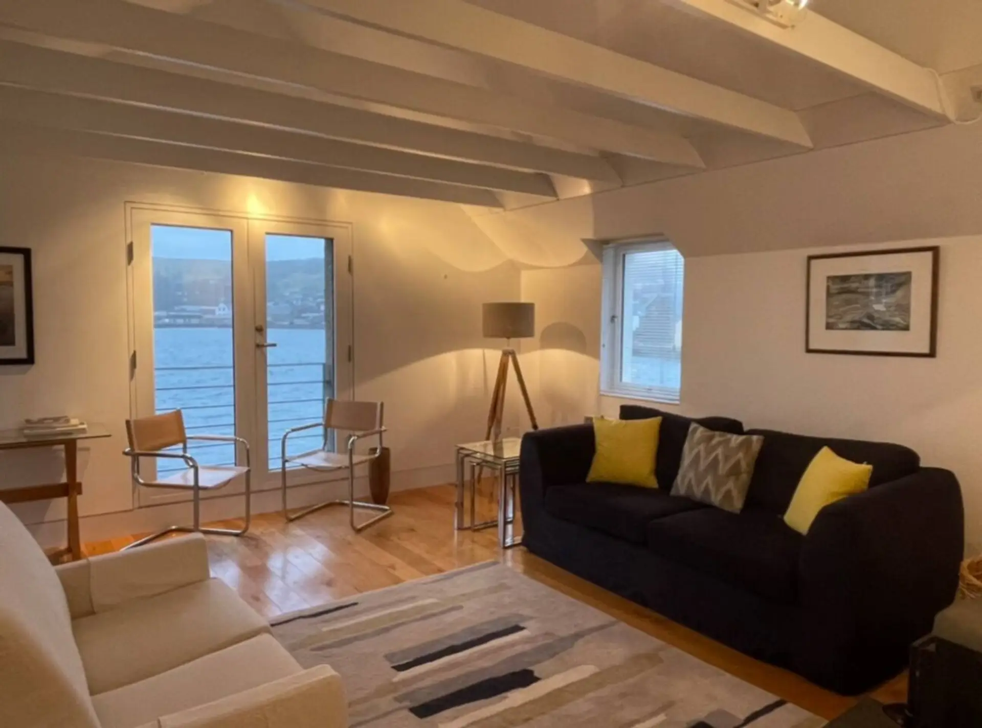 Bright living room and harbour views