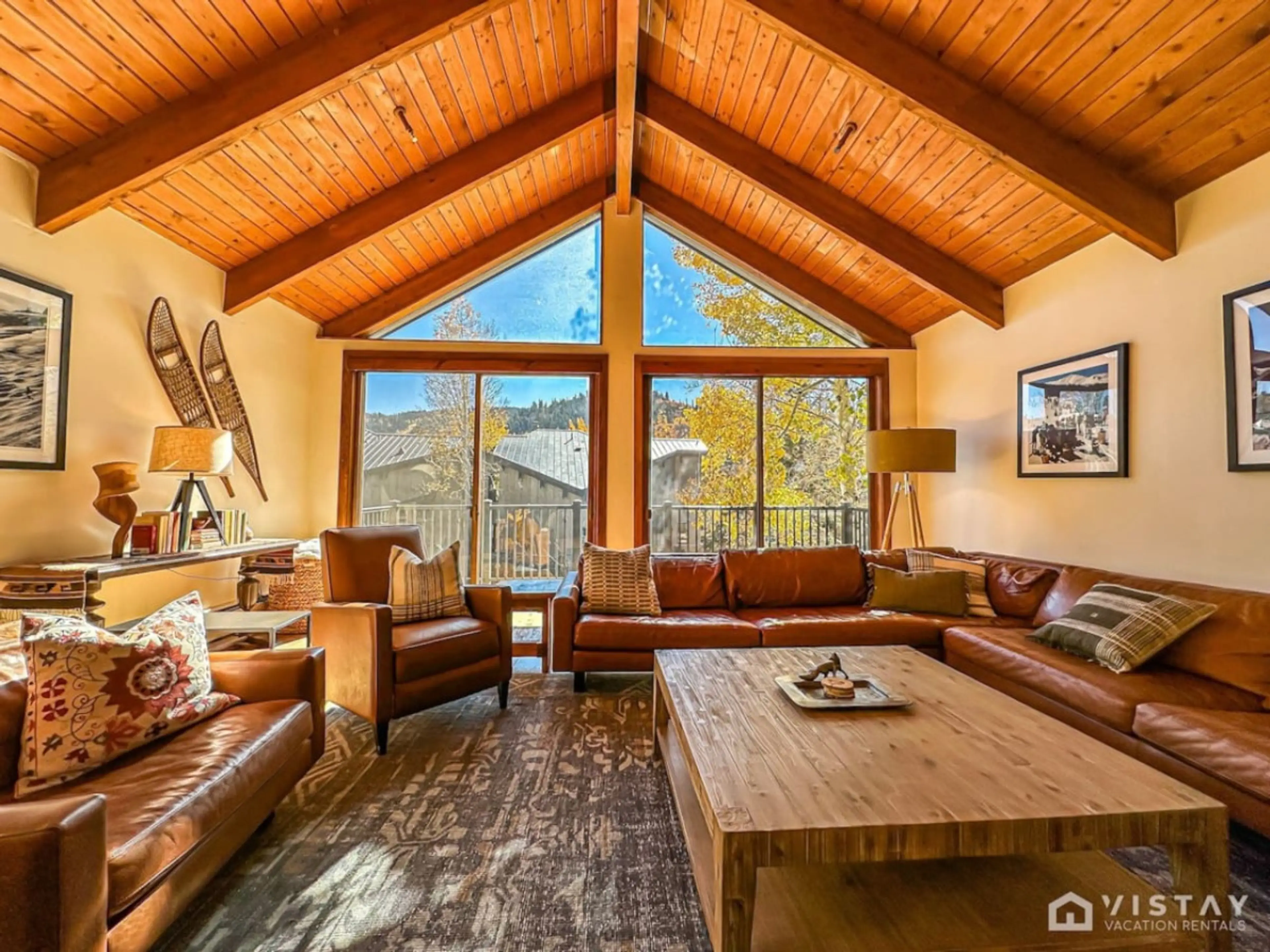 Adorned with mountain decor and art, the room exudes a warm and inviting ambiance.