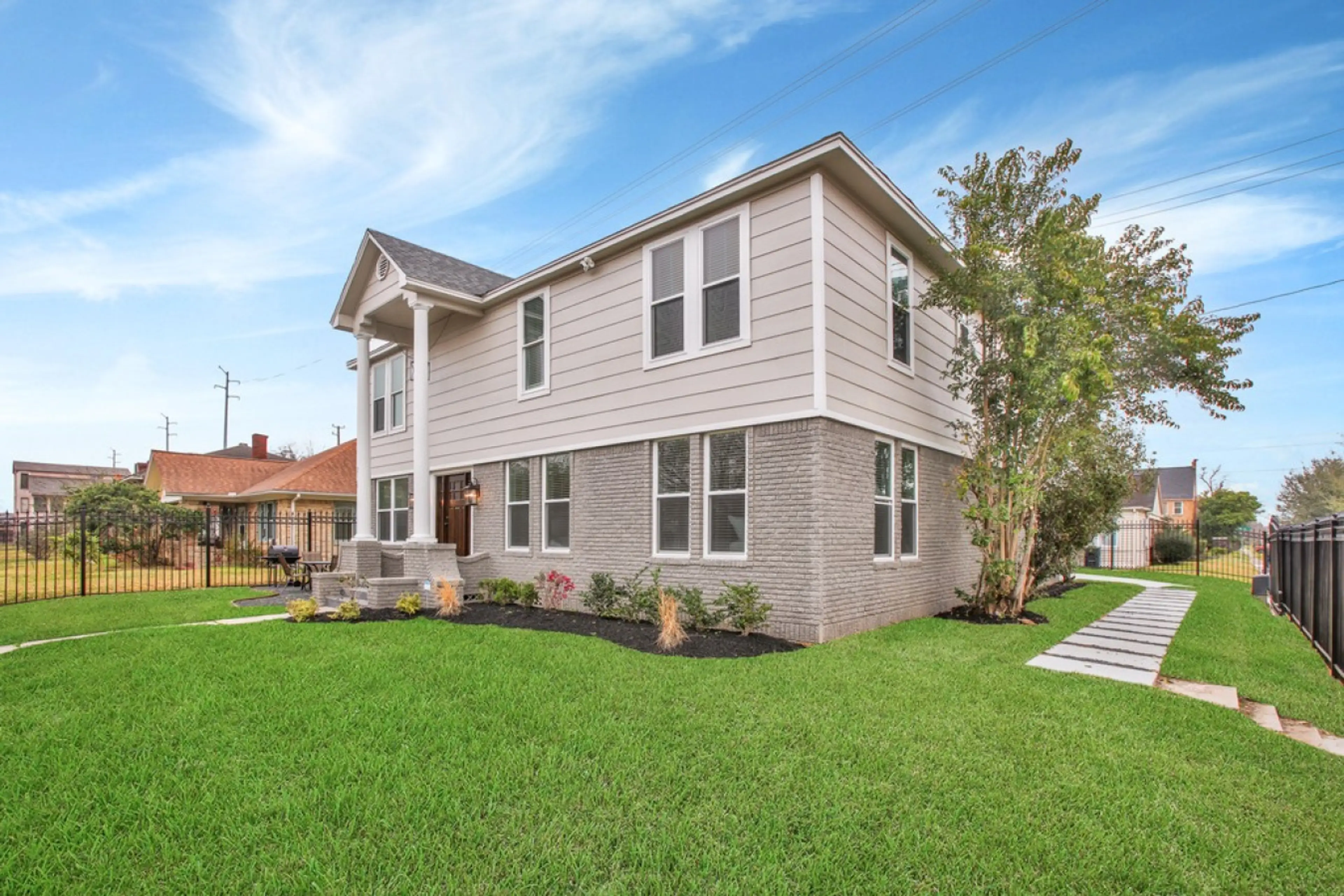 Take in the sight of the fully secured property from the front. Experience peace of mind with two pedestrian gates and one automatic vehicle gate, ensuring your safety while you're our valued guest.