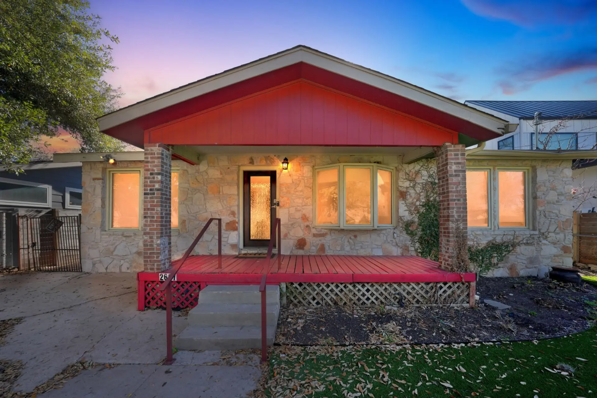Welcoming front exterior with great curb appeal and a comfortable, lived-in charm with turfed front yard..