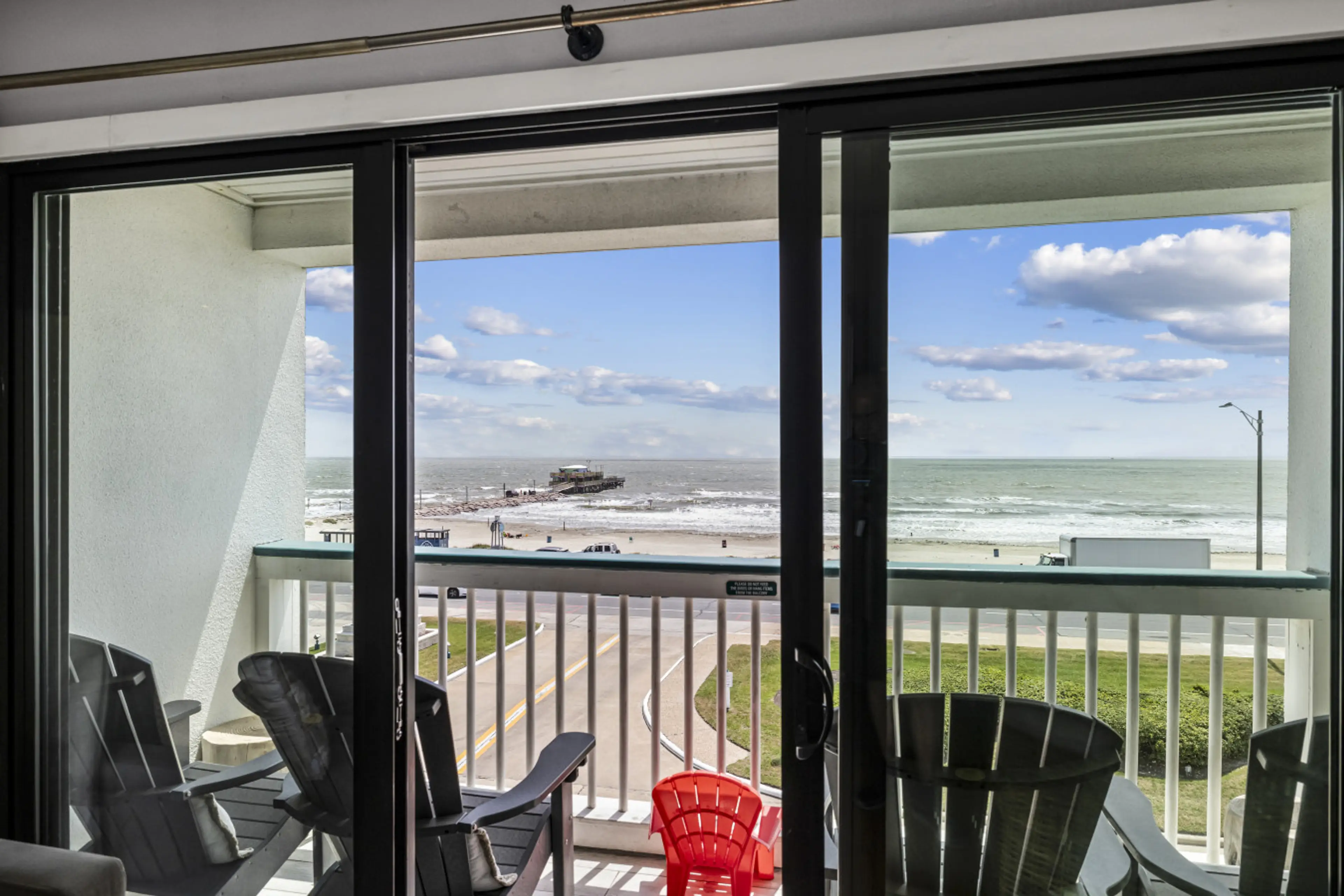 Wake up to panoramic Gulf views from your private top-floor balcony in Galveston