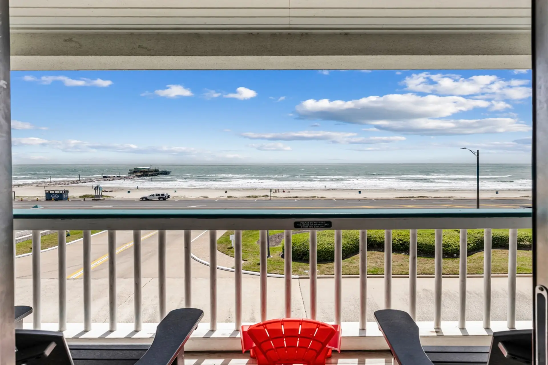 Wake up to panoramic Gulf views from your private top-floor balcony in Galveston