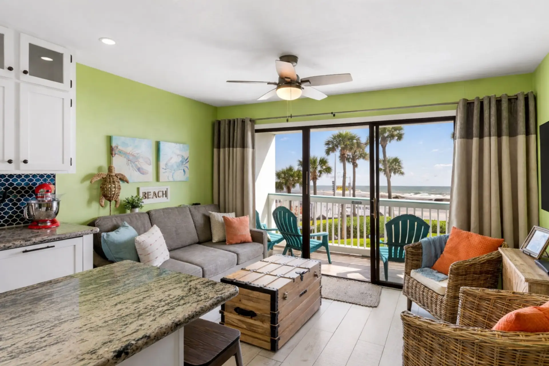 Relaxing coastal living room with direct Gulf view access in Galveston.