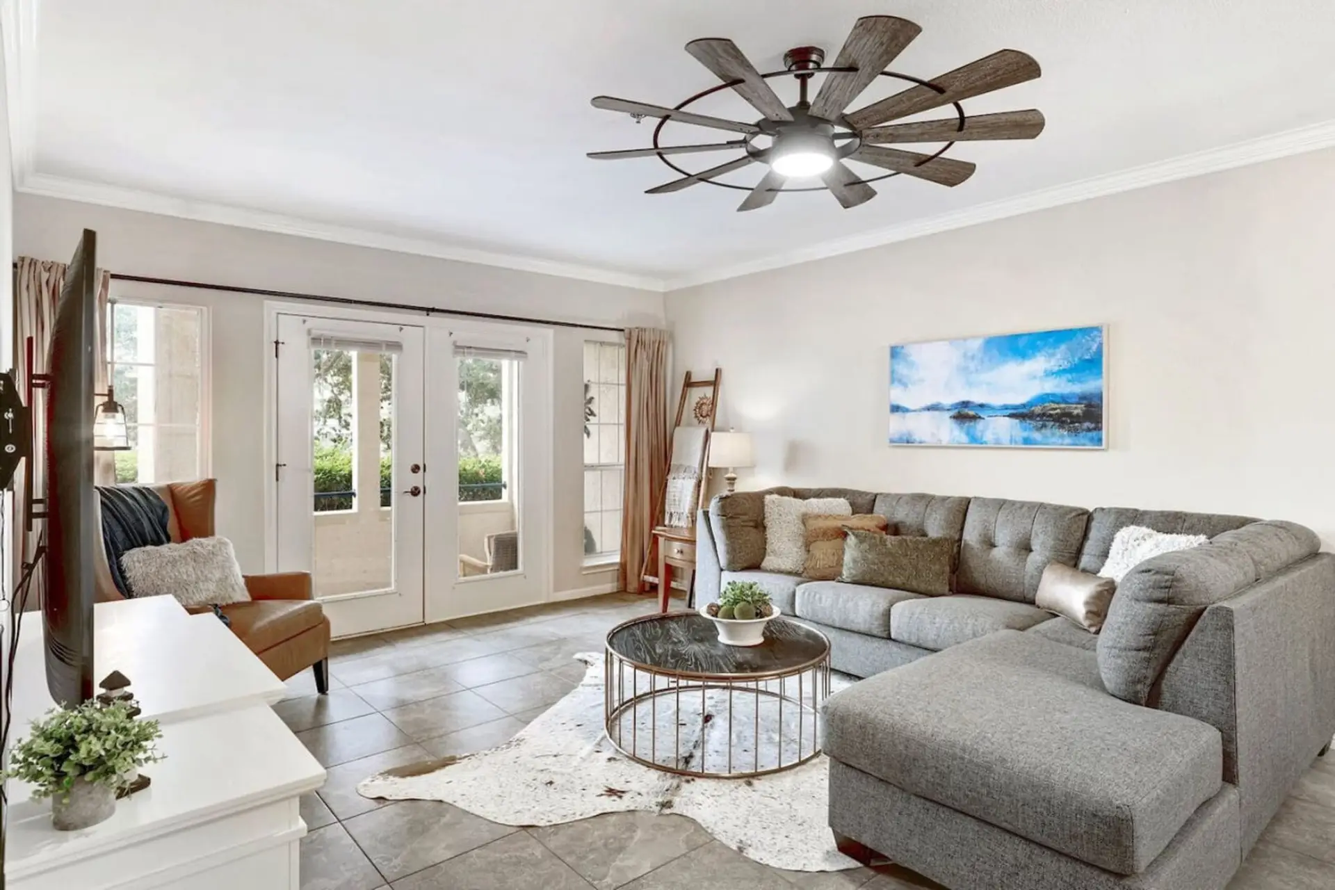 Relax in a bright Lago Vista lake cove view condo with spacious seating and natural light