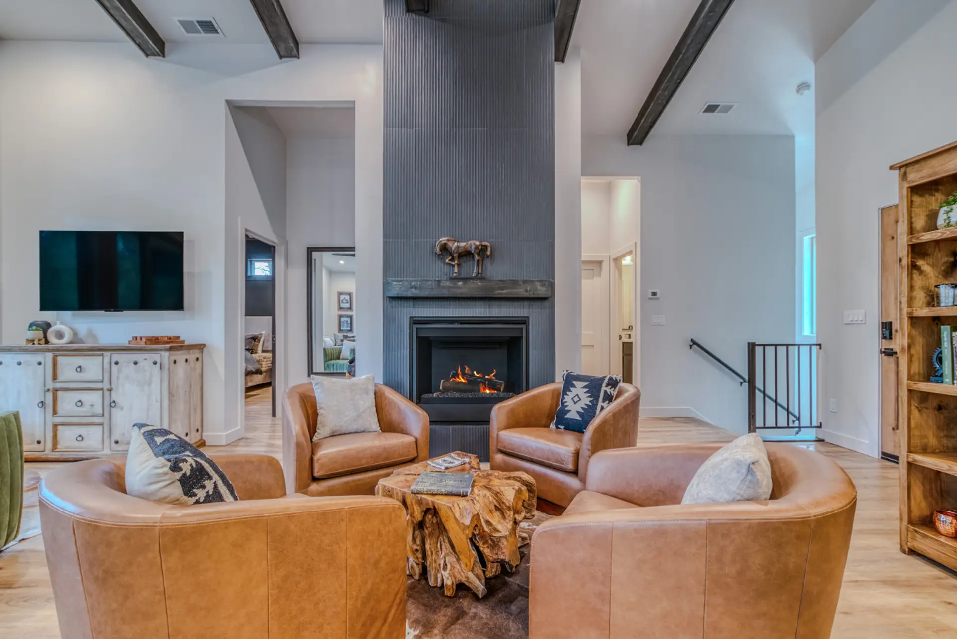 Vaulted ceilings and cozy fireplace in this luxury riverfront cabin in Midtown Ruidoso