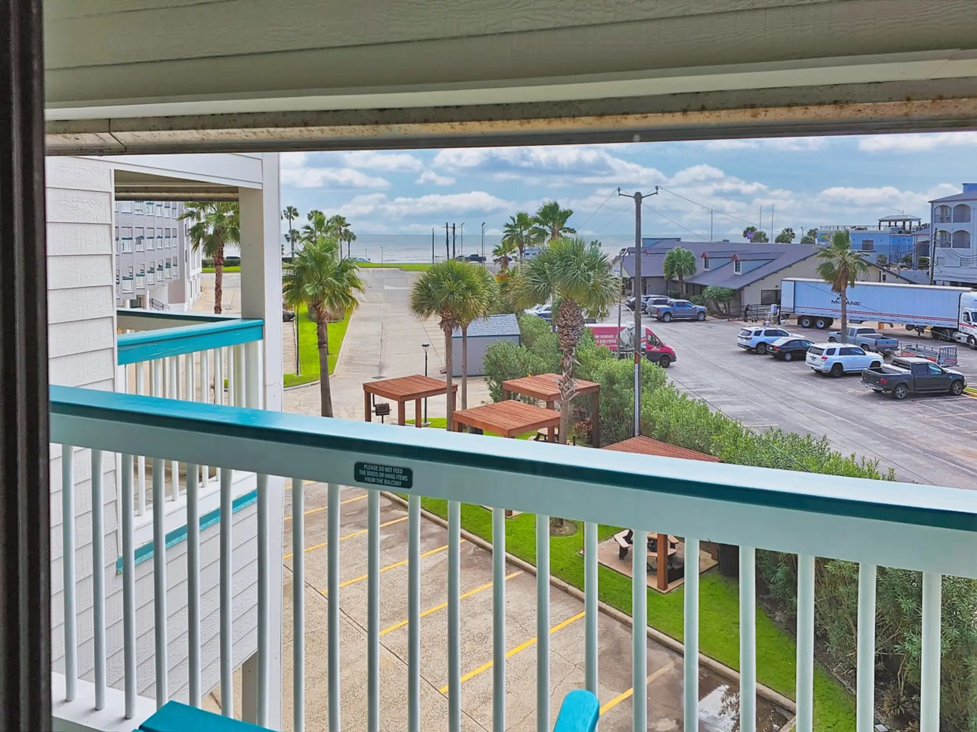 Private balcony at Condo #292 with coastal breezes and a lively Seawall view—perfect for morning coffee and laid-back people watching.