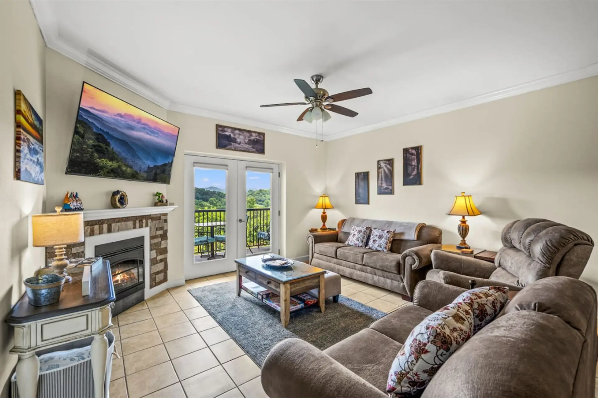 Living room with balcony access and built-in fireplace