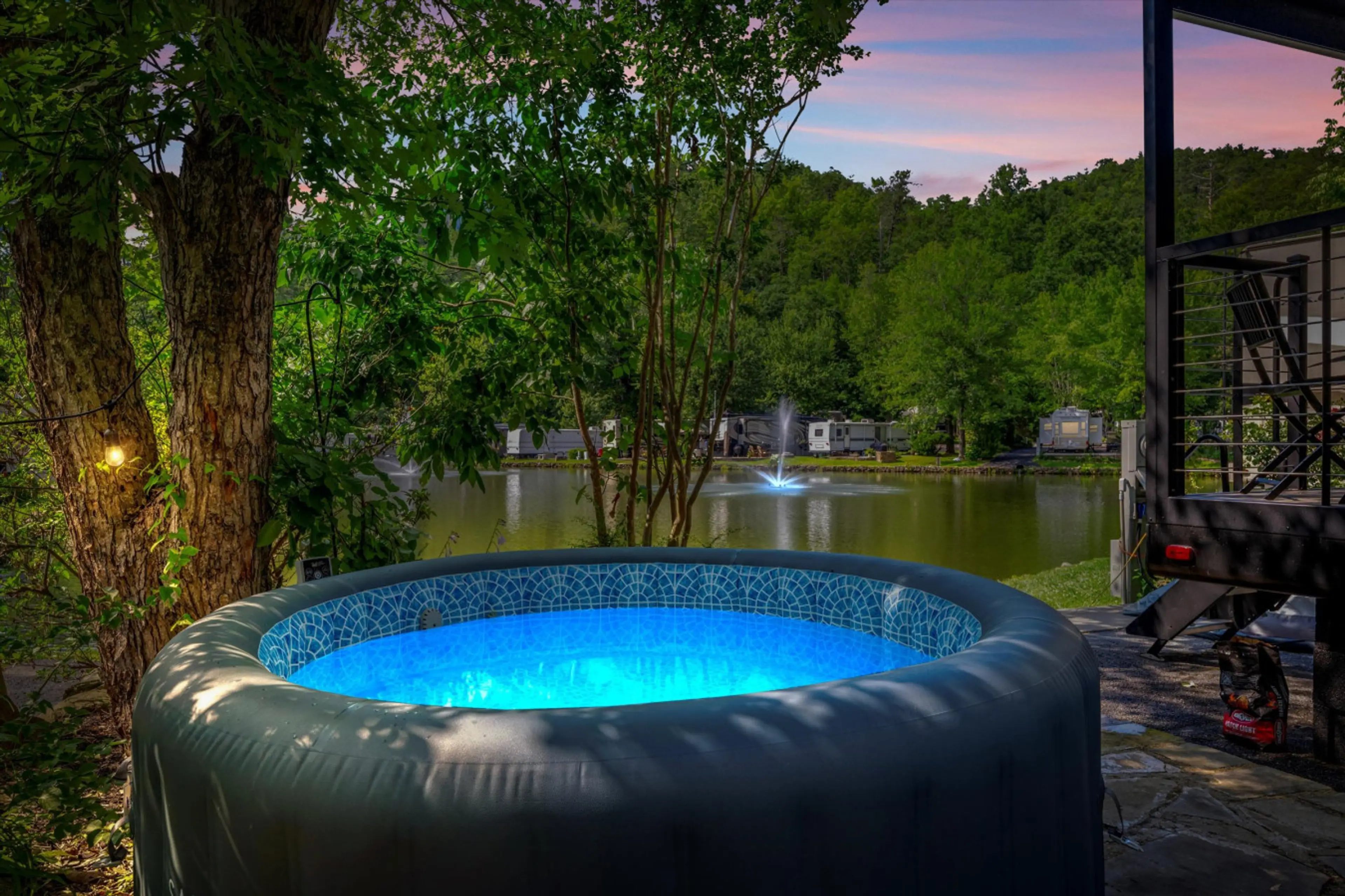 Hot tub with a view of the fishing pond and mountainside