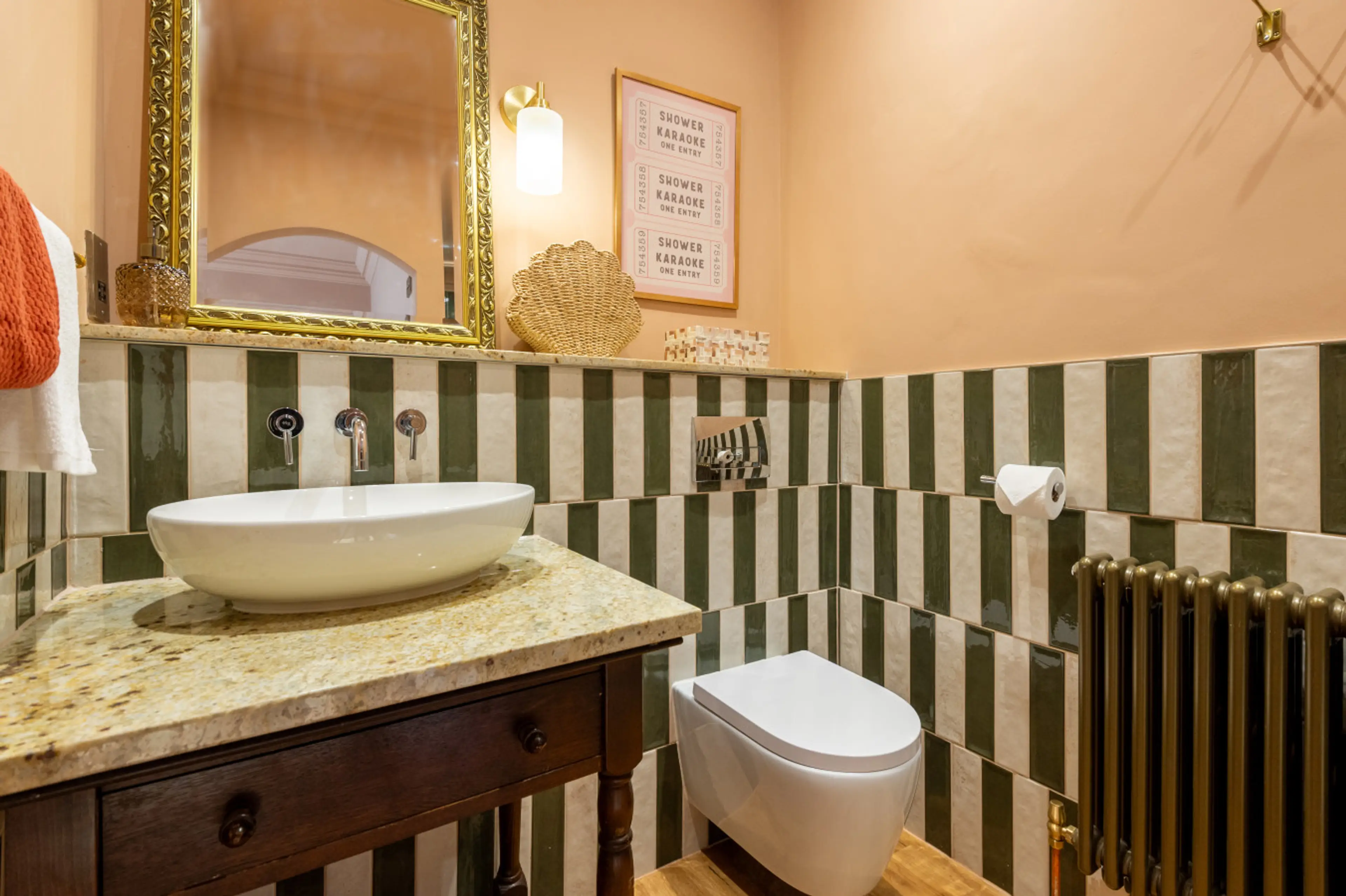 Modern en-suite bathroom with a refreshing shower and all essentials.