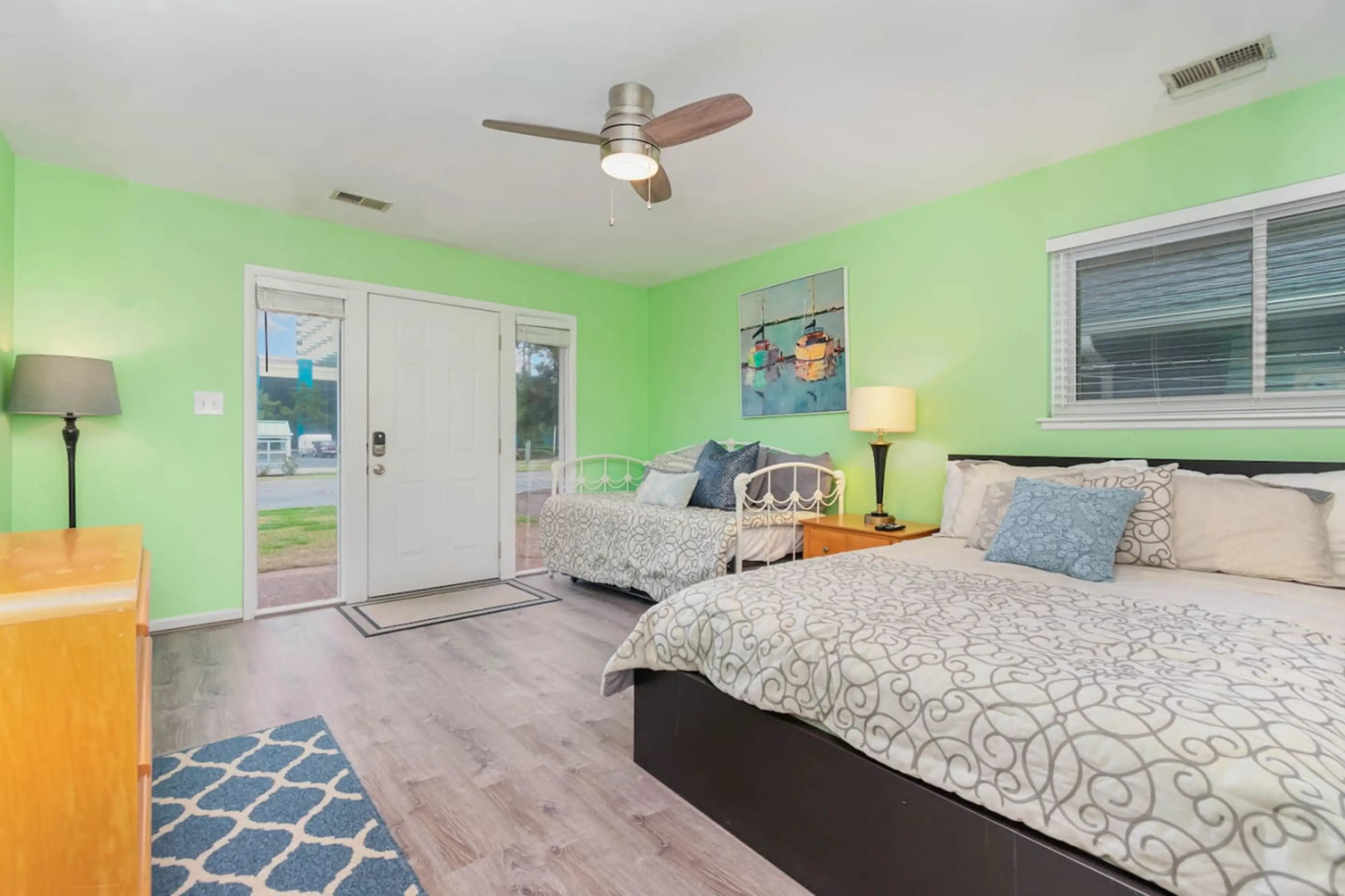 The front bedroom has room for three: a queen and twin bed.