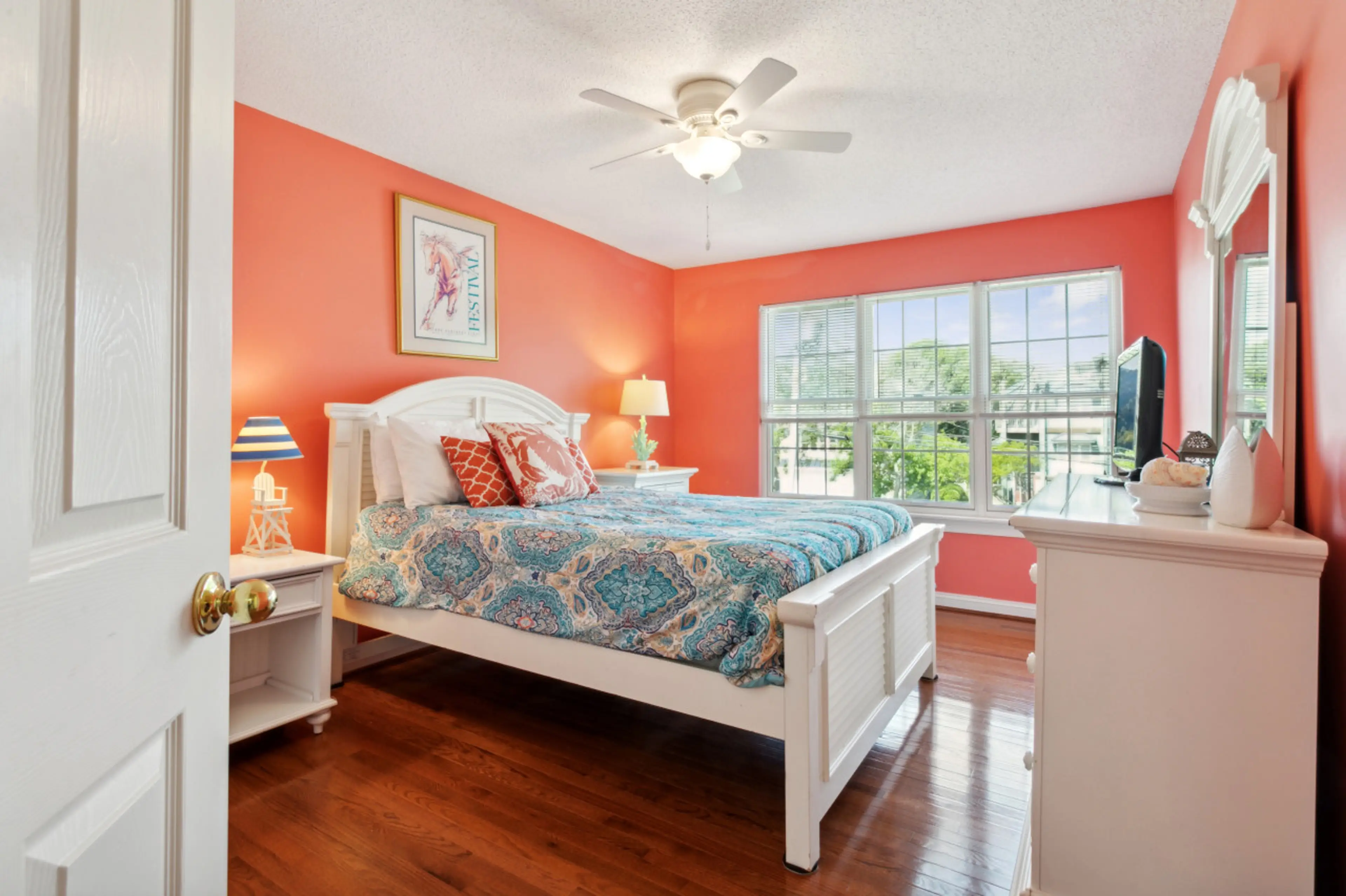 On the second floor, bedroom number 3 features a queen cozy bed in a peachy escape.