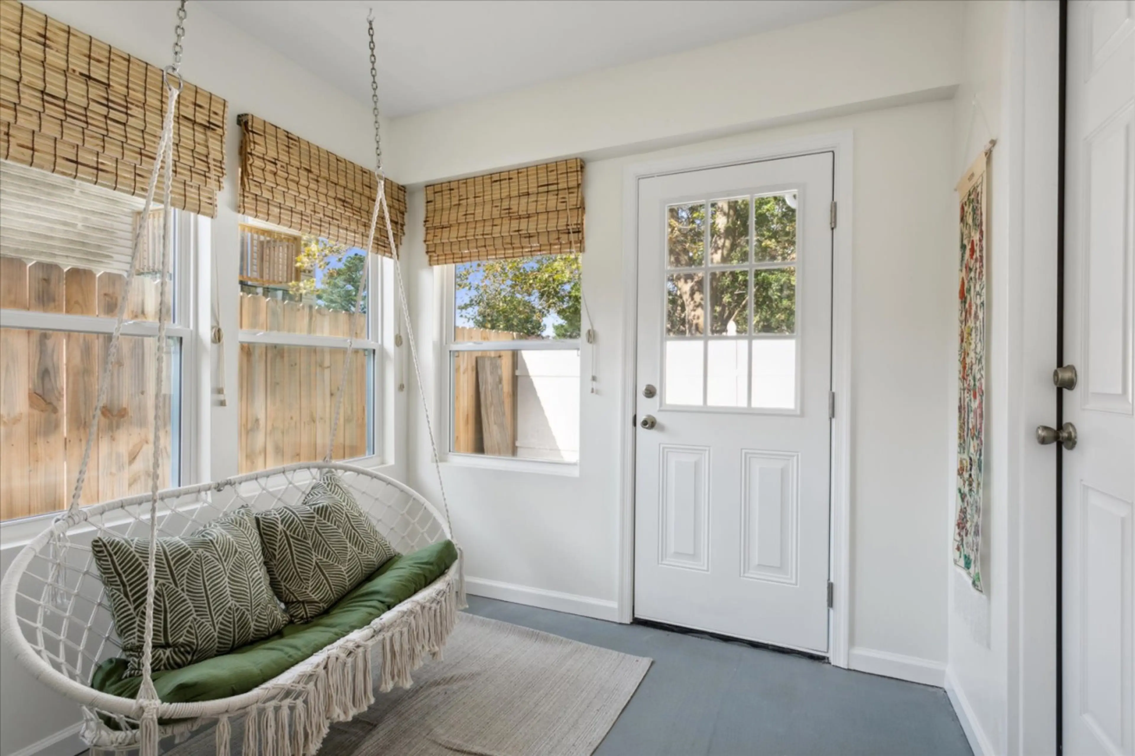 Enjoy any season in this seasonal room with an adorable swing! The perfect little book nook.