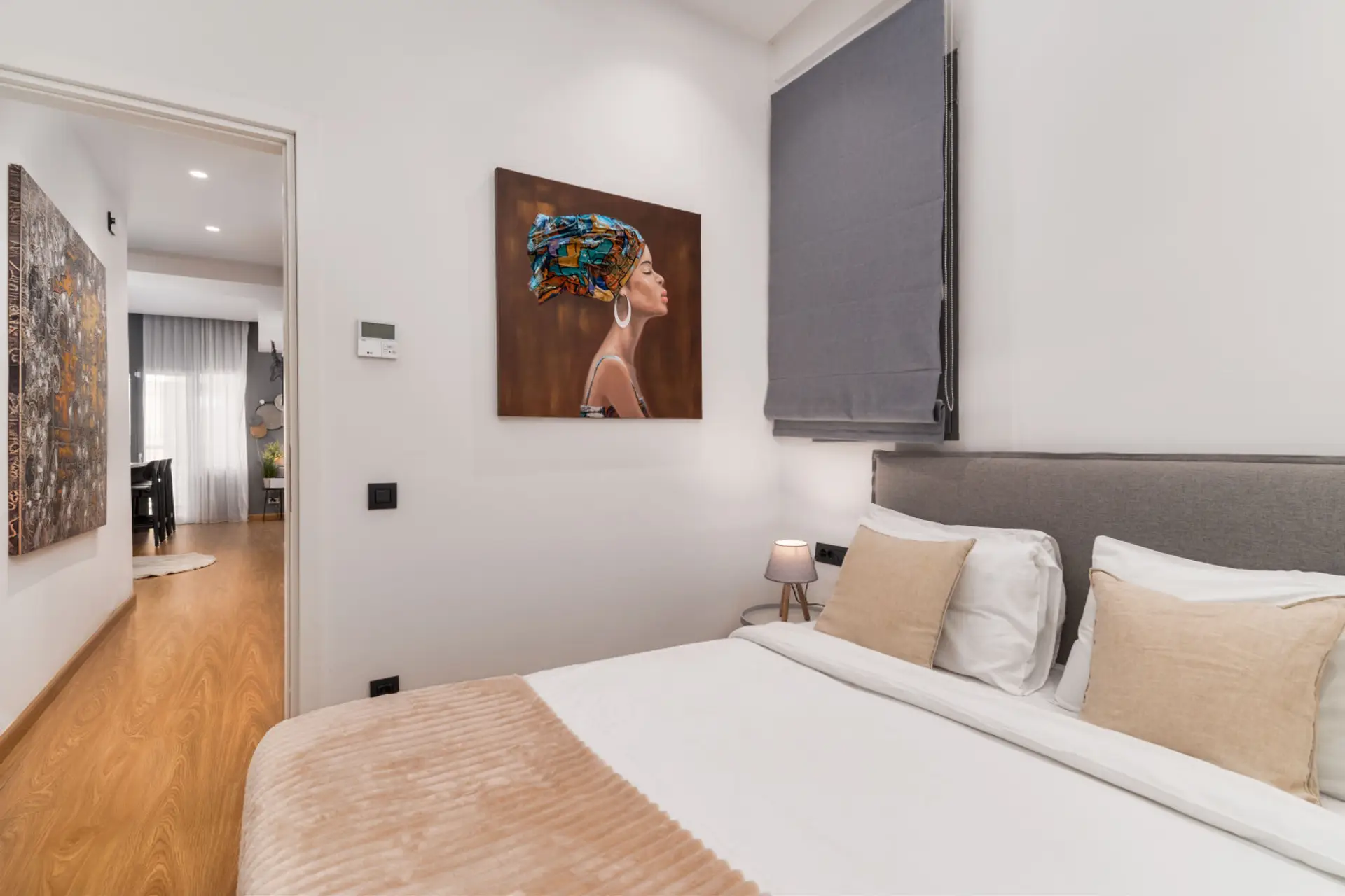 Soft tones, curated art, and a cocoon-like feel — the master bedroom invites deep rest and understated sophistication.