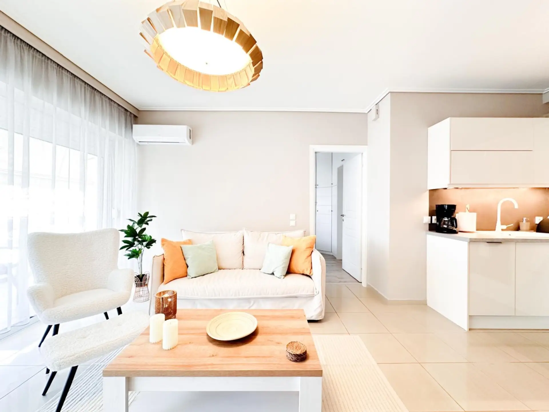 Sunlit lounge flowing into the modern kitchen