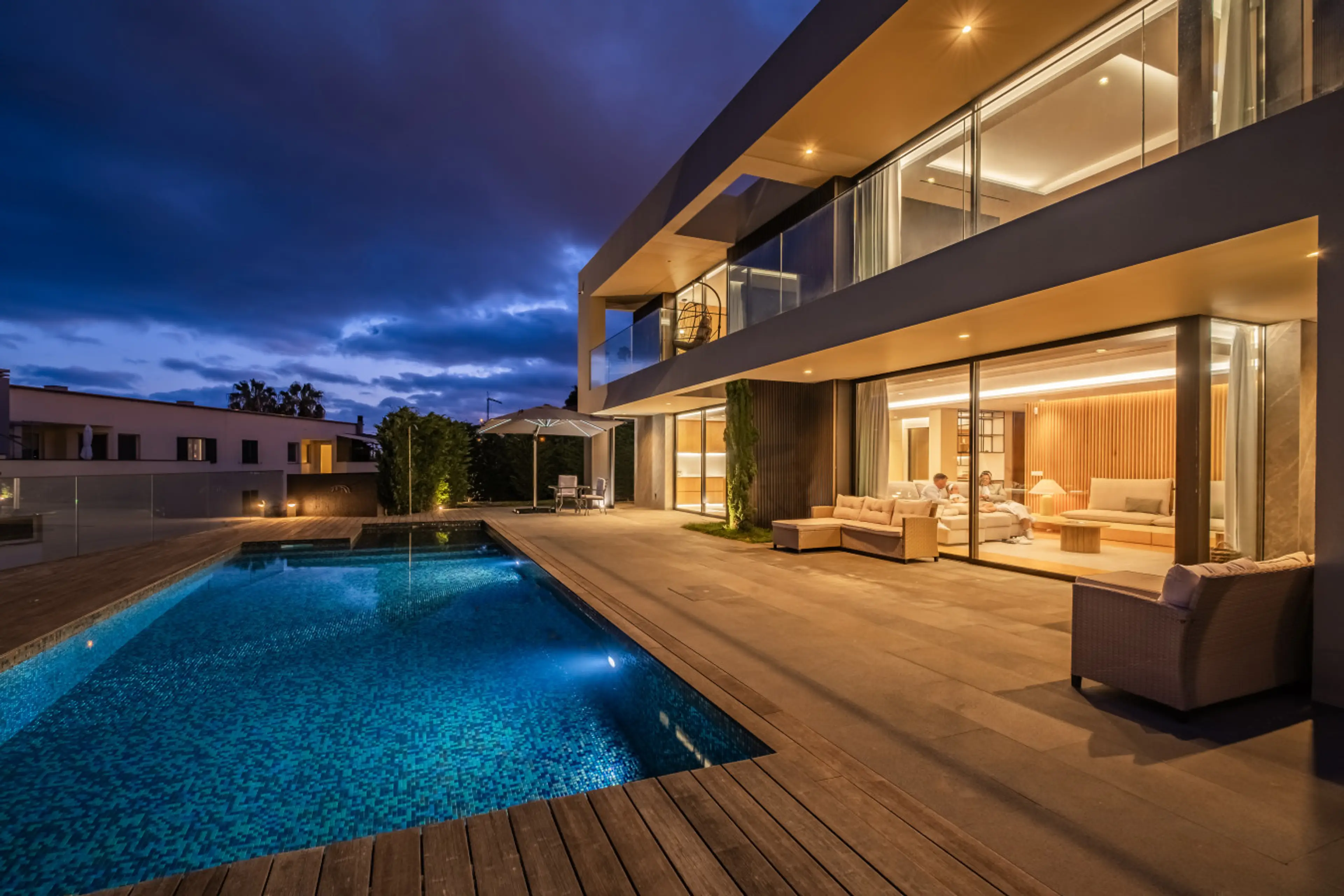 Discover a tranquil Madeira night setting shaped by soft lighting and contemporary lines around the pool terrace.