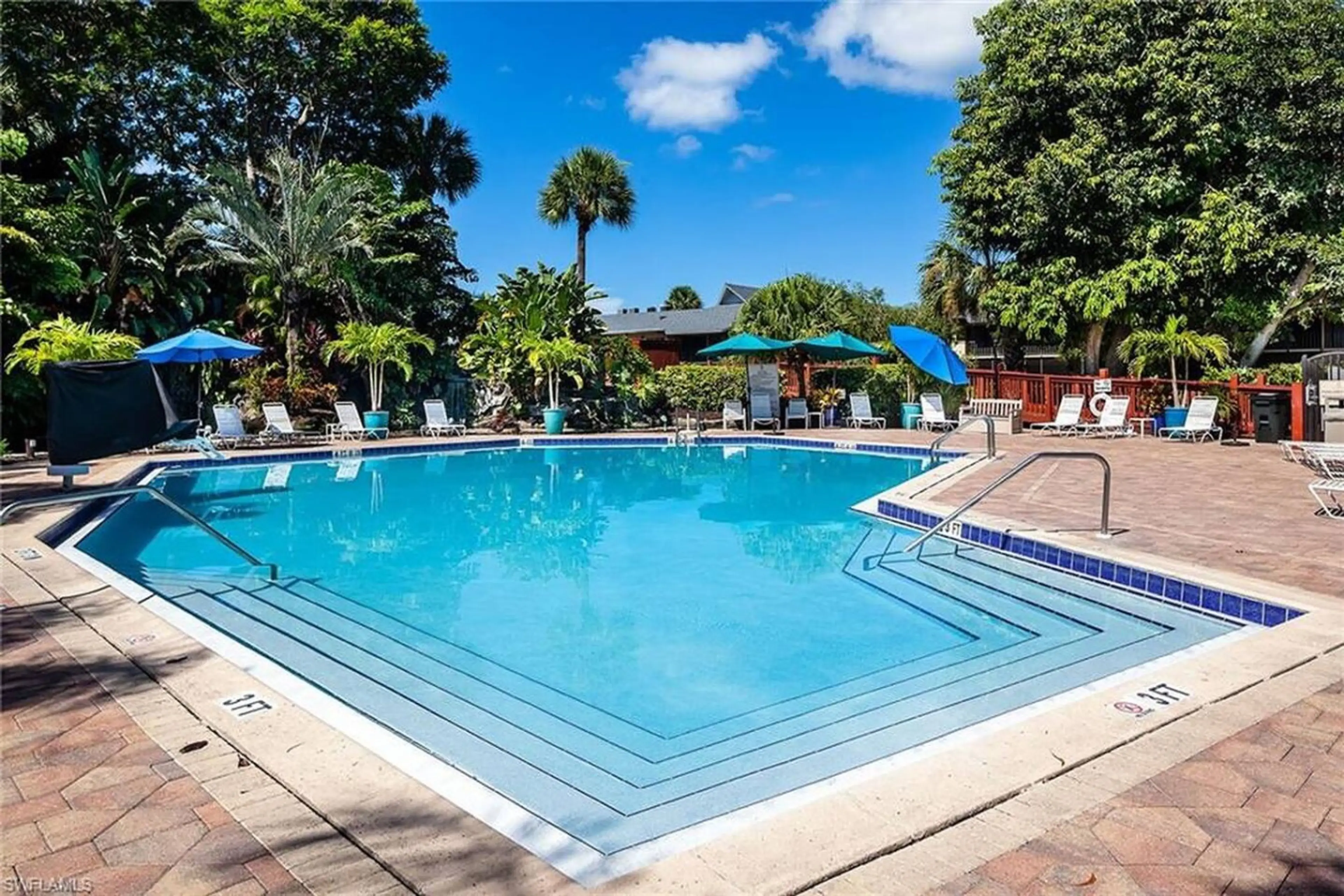 Resort-style pool with plenty of seating around the pool.