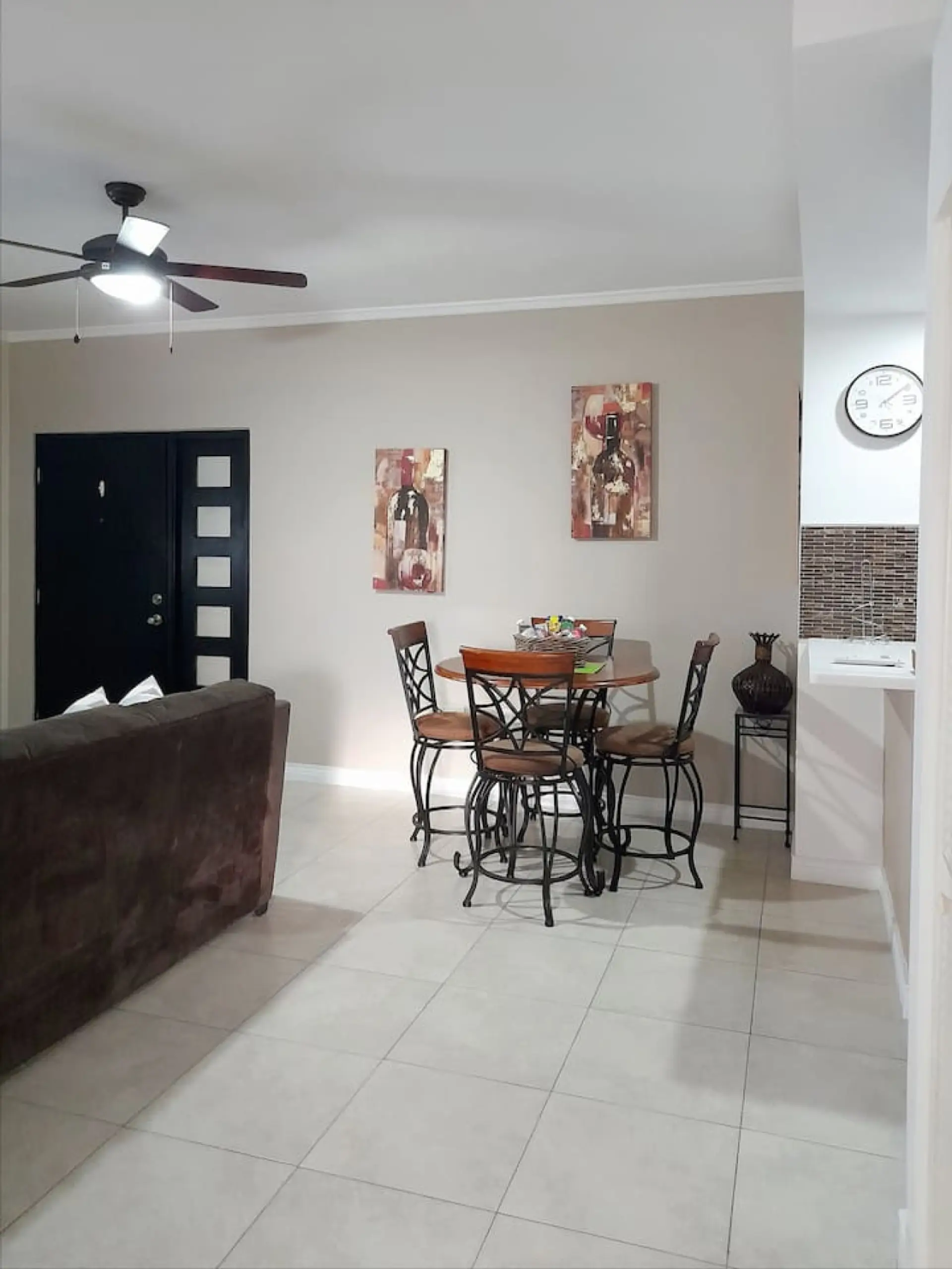 Dining table set beside the entry, perfect for shared meals or a casual game night