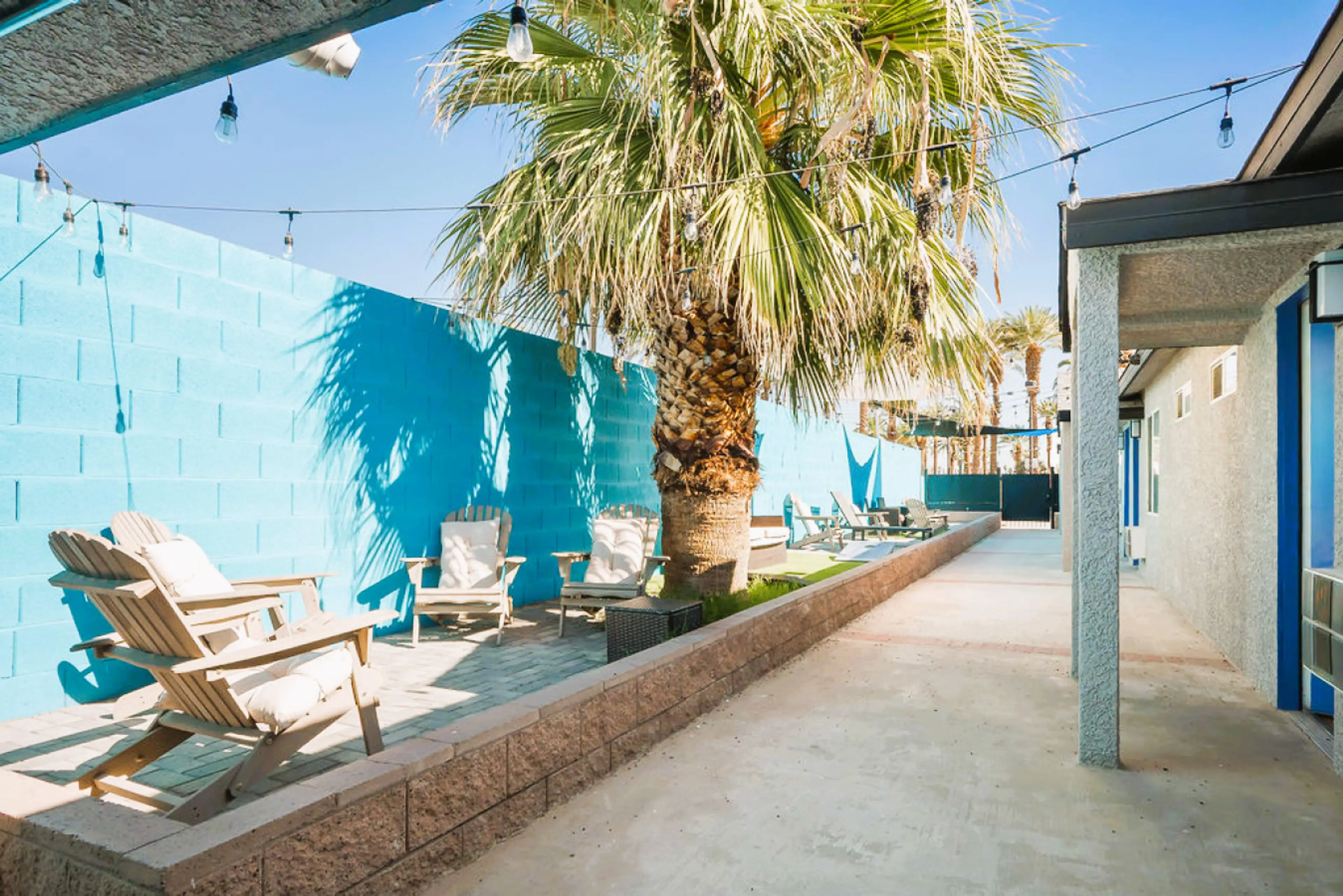 Outdoor Oasis: Relax under swaying palms and twinkling lights in your private retreat!