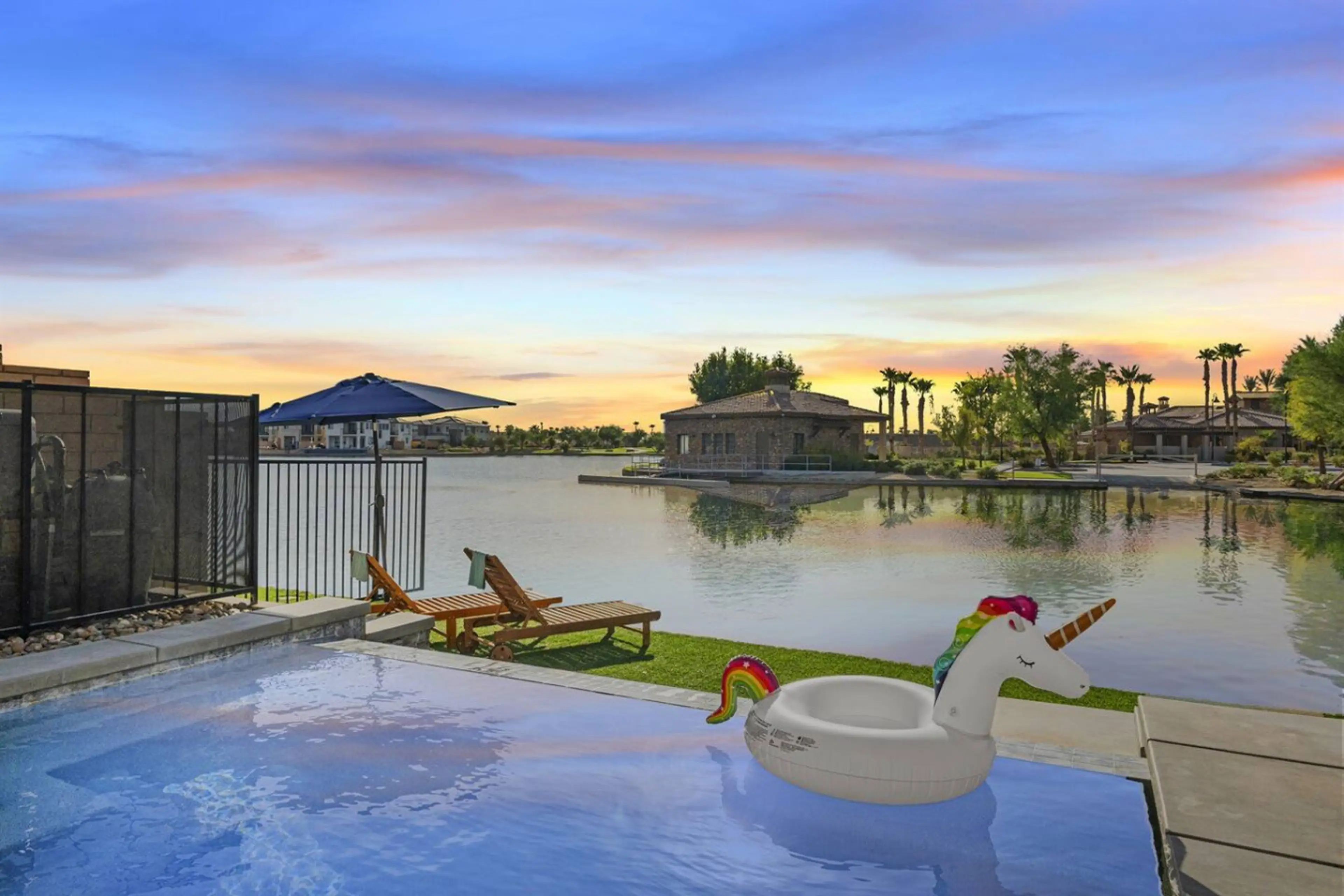Outdoor Oasis: Sip cocktails by the shimmering pool, with stunning sunset views over the lake!