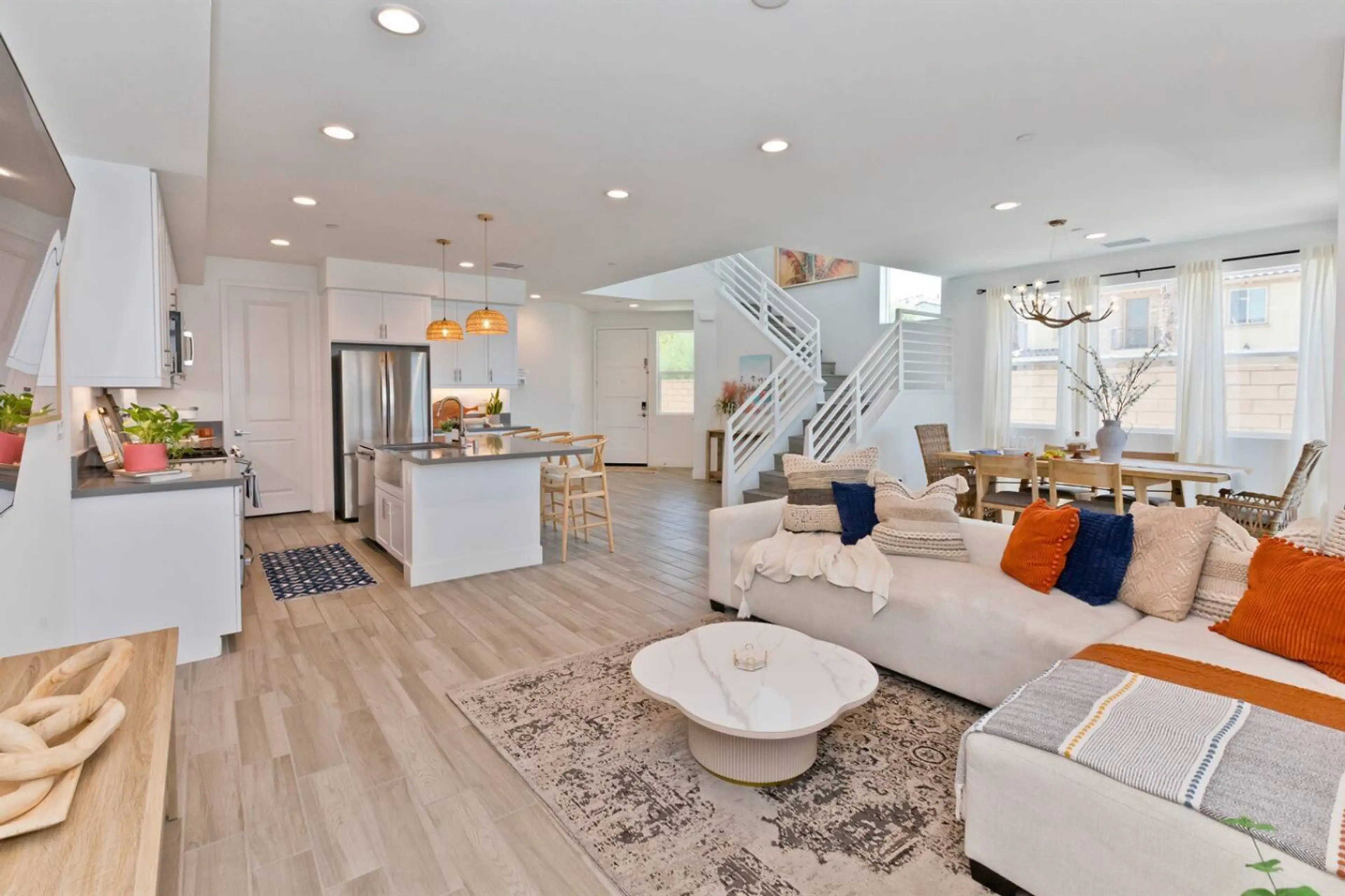 Experience ultimate comfort in our living room, where oversized windows flood the space with natural light, creating the ideal setting to escape the hustle and bustle.