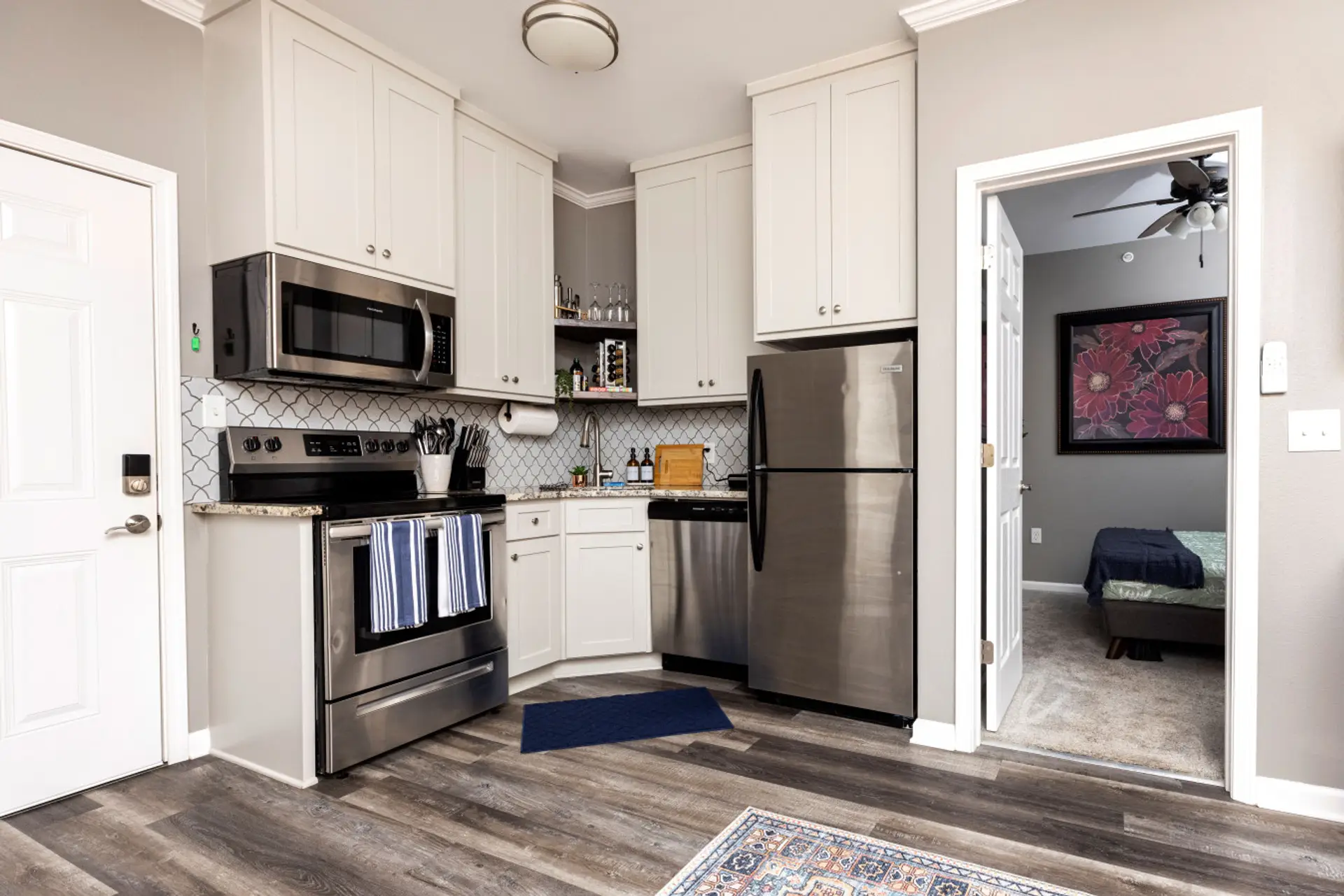 Whether it's breakfast or dinner, our full kitchen is ready with stainless steel appliances — including a fridge/freezer, stove, oven, microwave, and dishwasher — so you can feel at home while you're away.