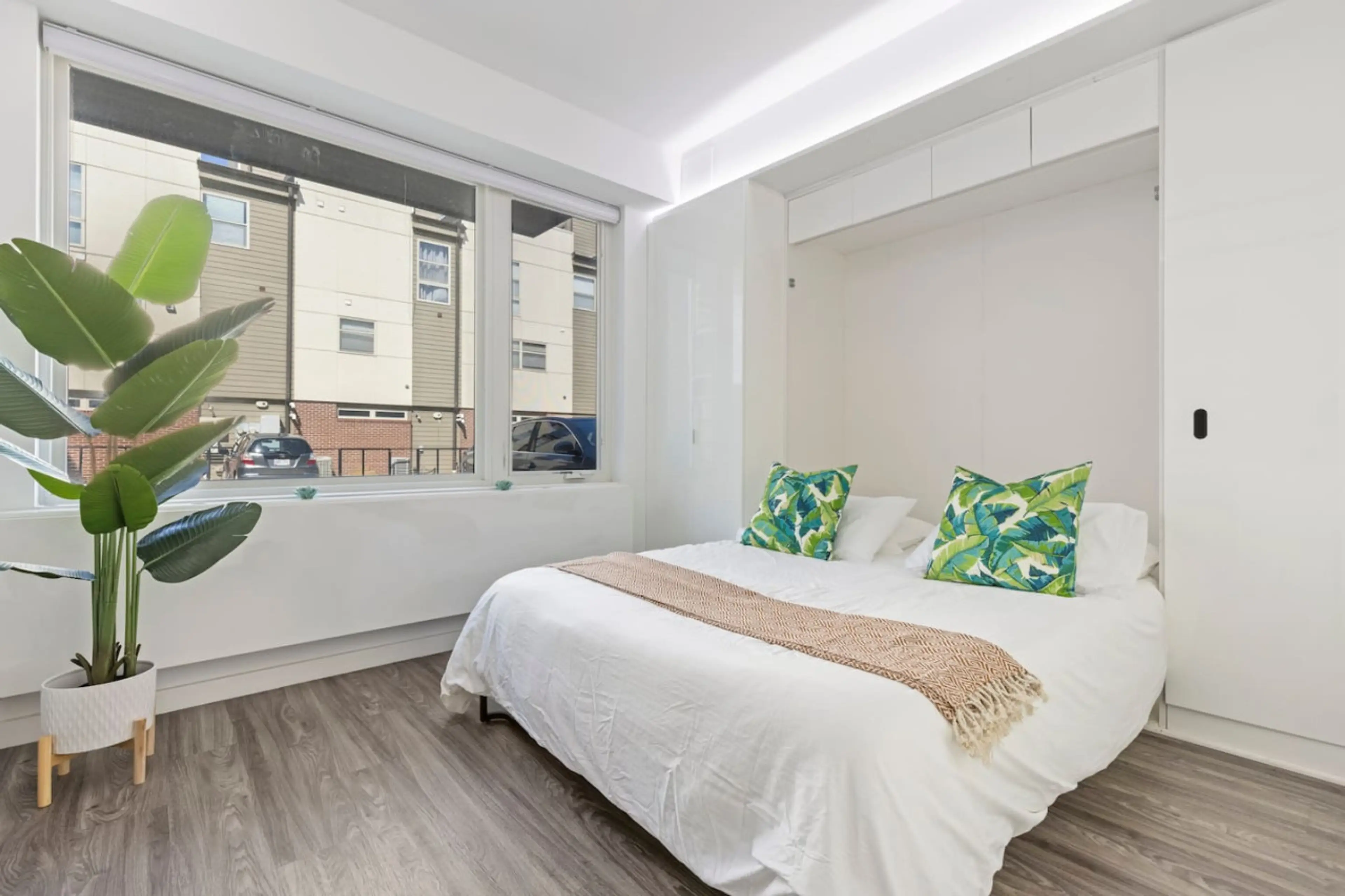 You feel enveloped in comfort as you relax on the queen bed, surrounded by a room designed for tranquility.