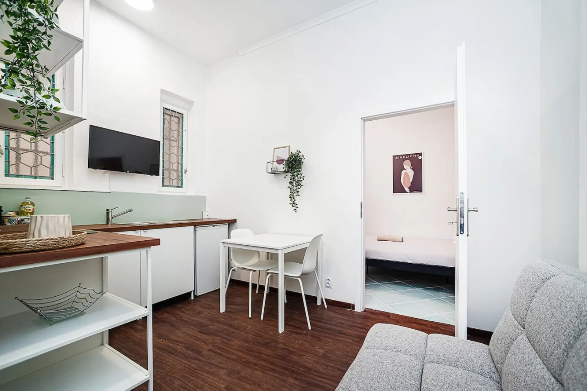 kitchen with seating area and door to the bedroom