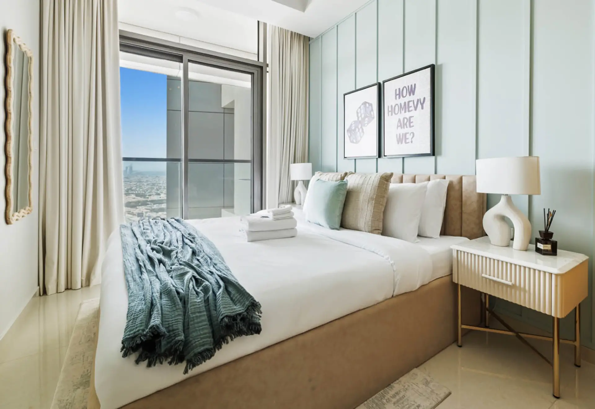 Cozy King bed with soft linens and natural light