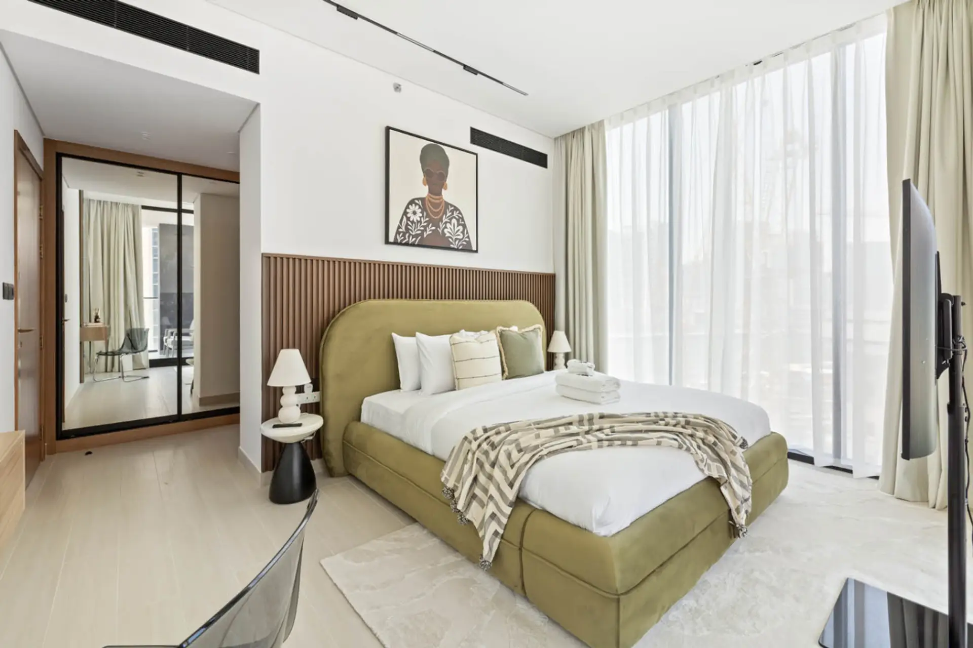 Spacious master bedroom with a king-size bed and soft quality linens