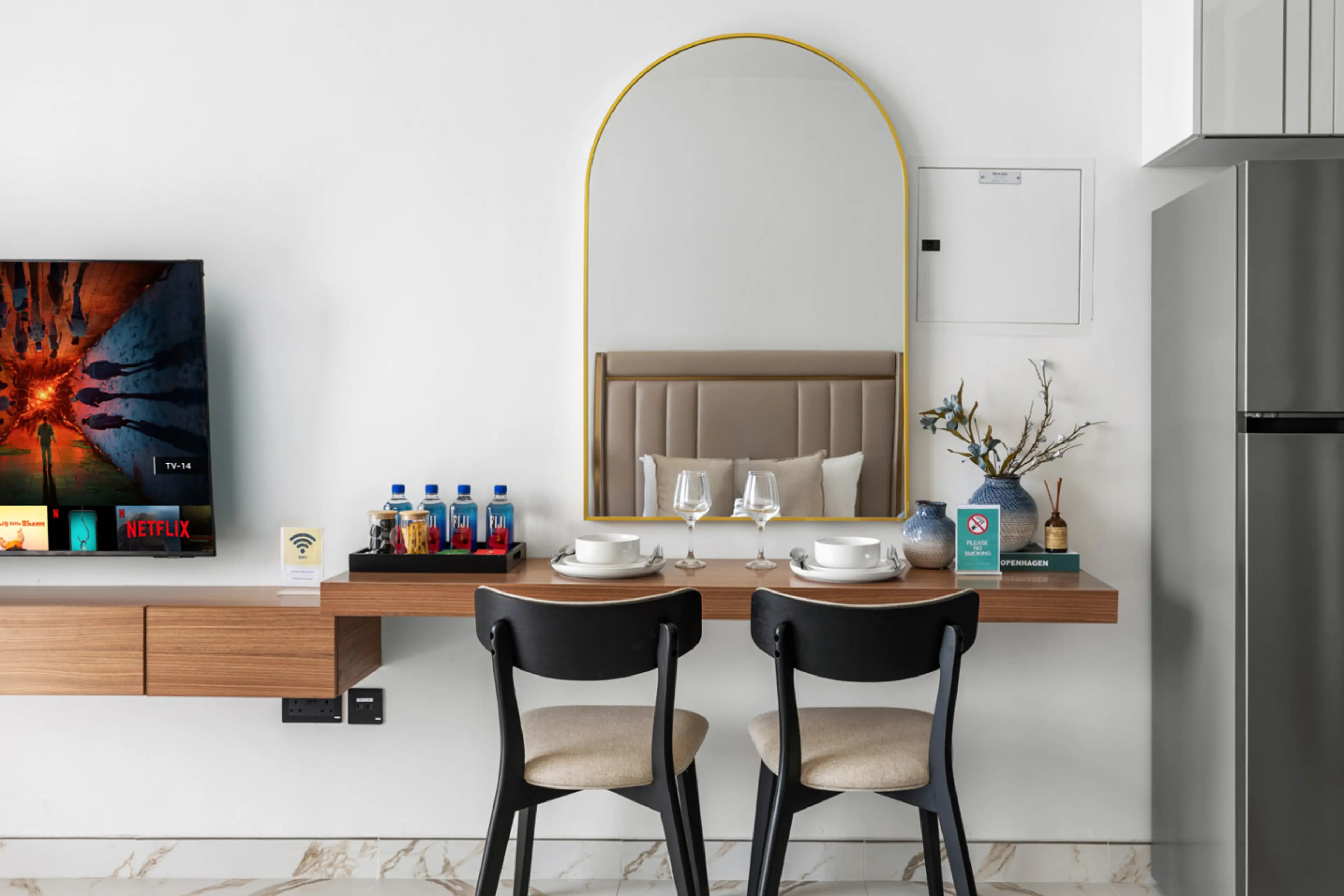 Elegant dining setup with plates, cups, spoons, and a protective cloth for a tidy meal