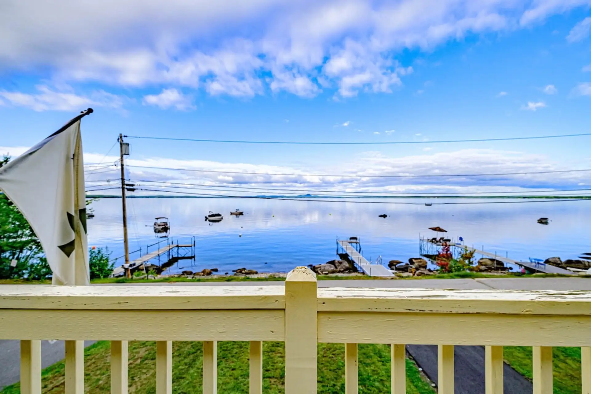 Upper Balcony/Sitting Area. Please note that your shared dock access is 12 houses down at the shared sandy beach. You are not permitted to use the docks across the street.