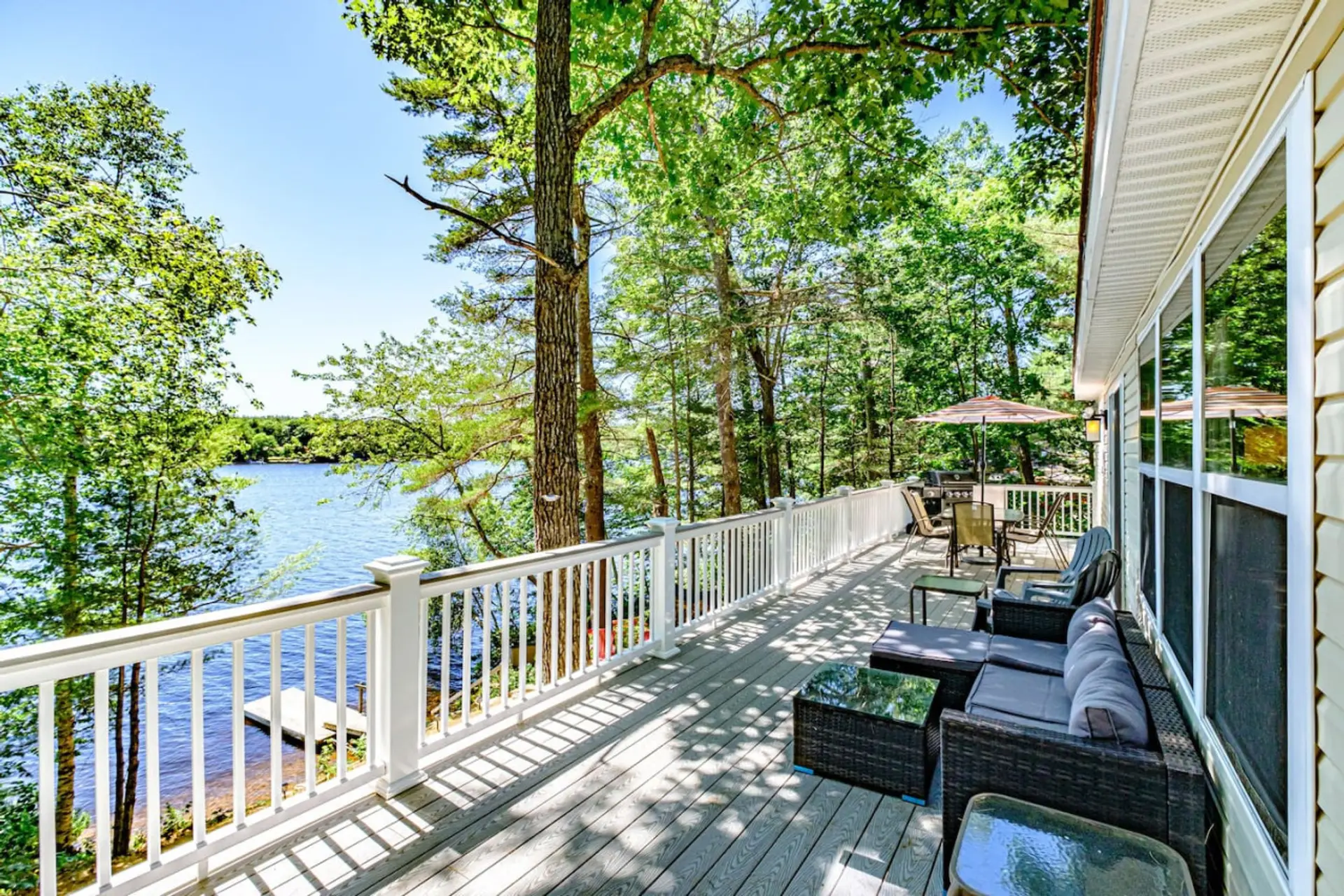 Outdoor deck with seating, gas grill and dining set