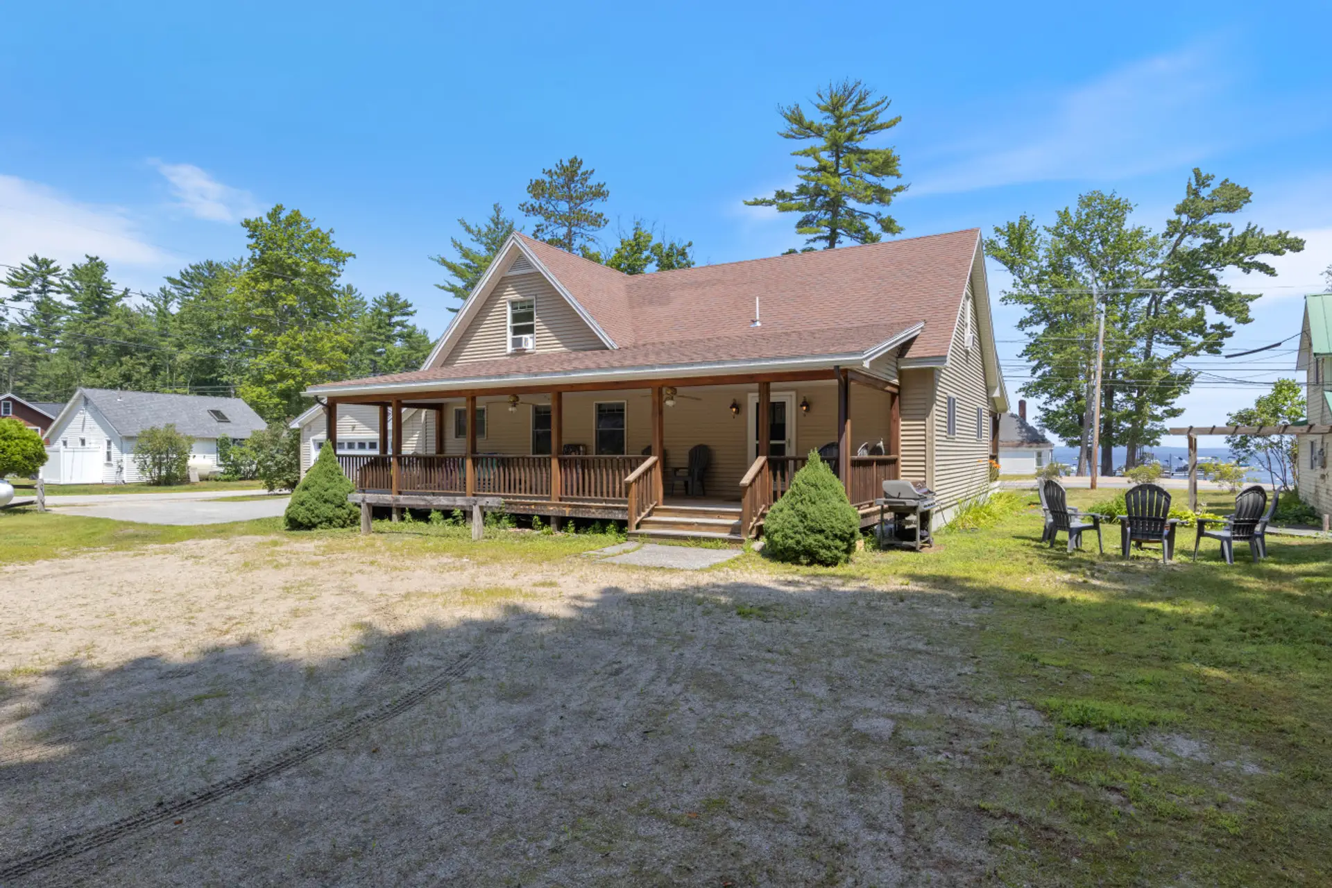 Exterior view - gas grill, fire pit with seating, ample parking and lake views