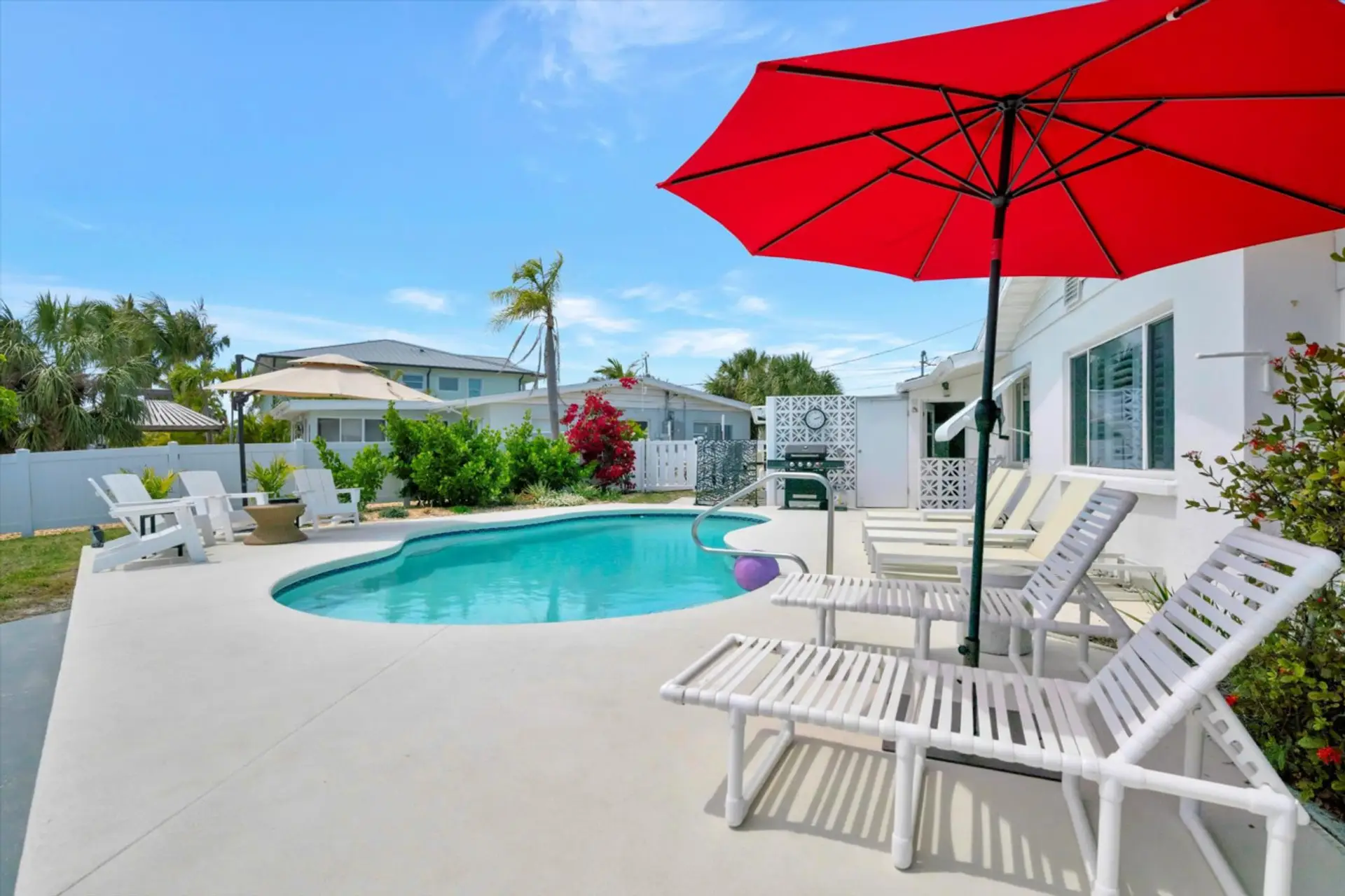 Relaxing Solar Heated Pool with Plenty of Chairs