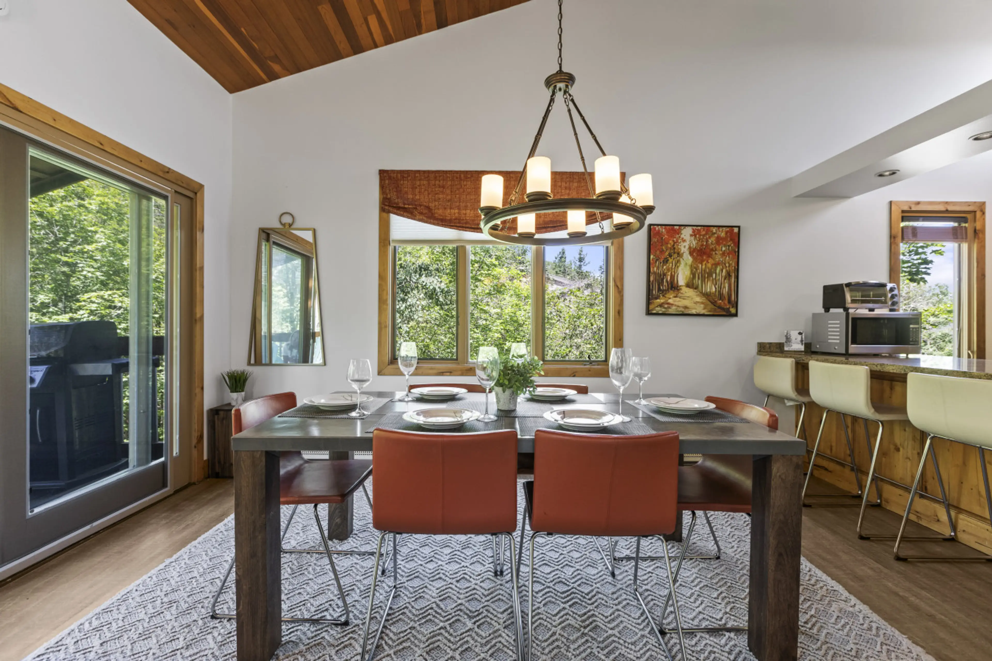 Gather around the table for dinner, stories, or a round of cards with mountain views just outside