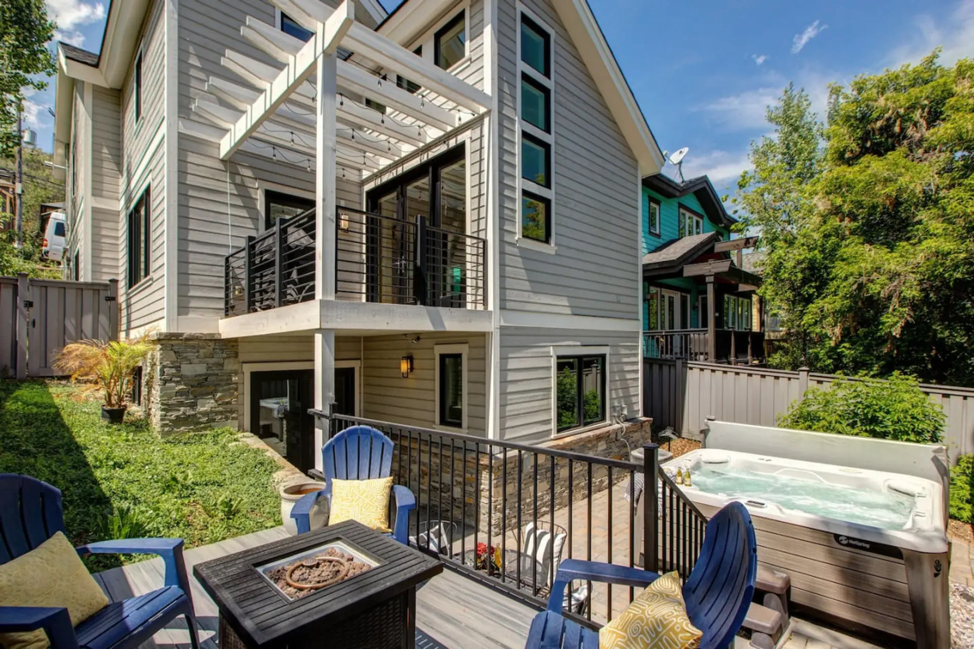 Backyard oasis with hot tub and fire pit