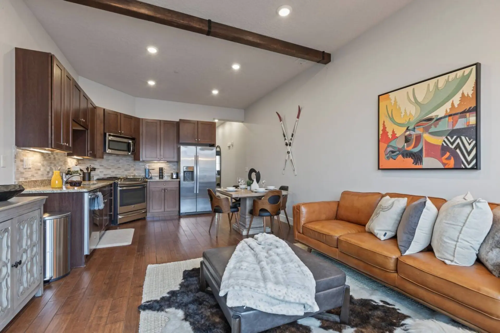 Enjoy the beautifully professionally decorated family room with heat lamps on the balcony and views of Olympic Park