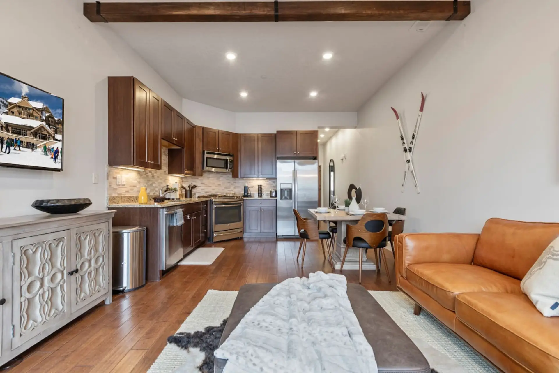 Enjoy the beautifully professionally decorated family room with heat lamps on the balcony and views of Olympic Park