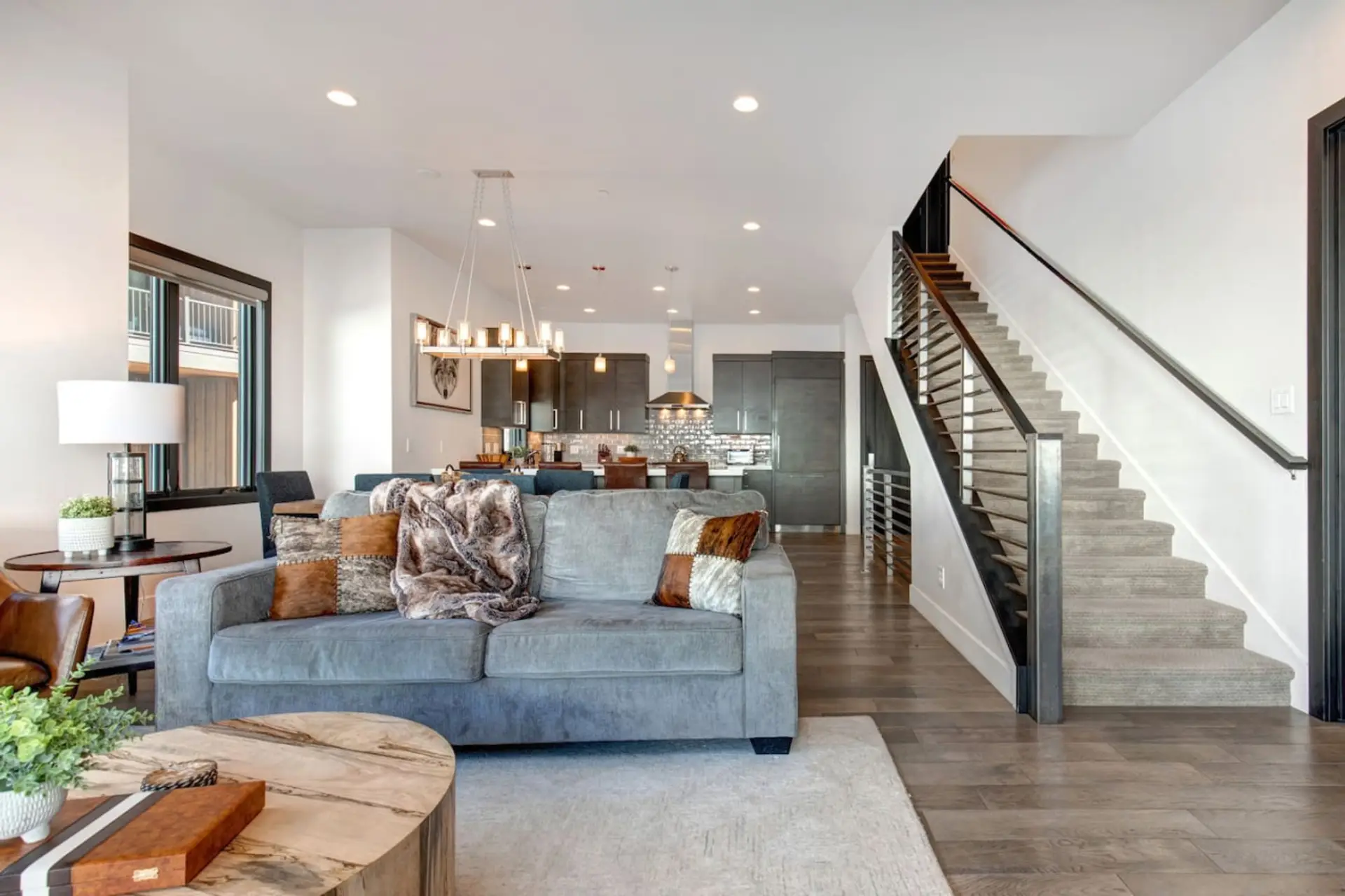 Family room, kitchen dining and family room.  You can see the stairs going up to the 3 bedrooms and down stairs to the garage.
