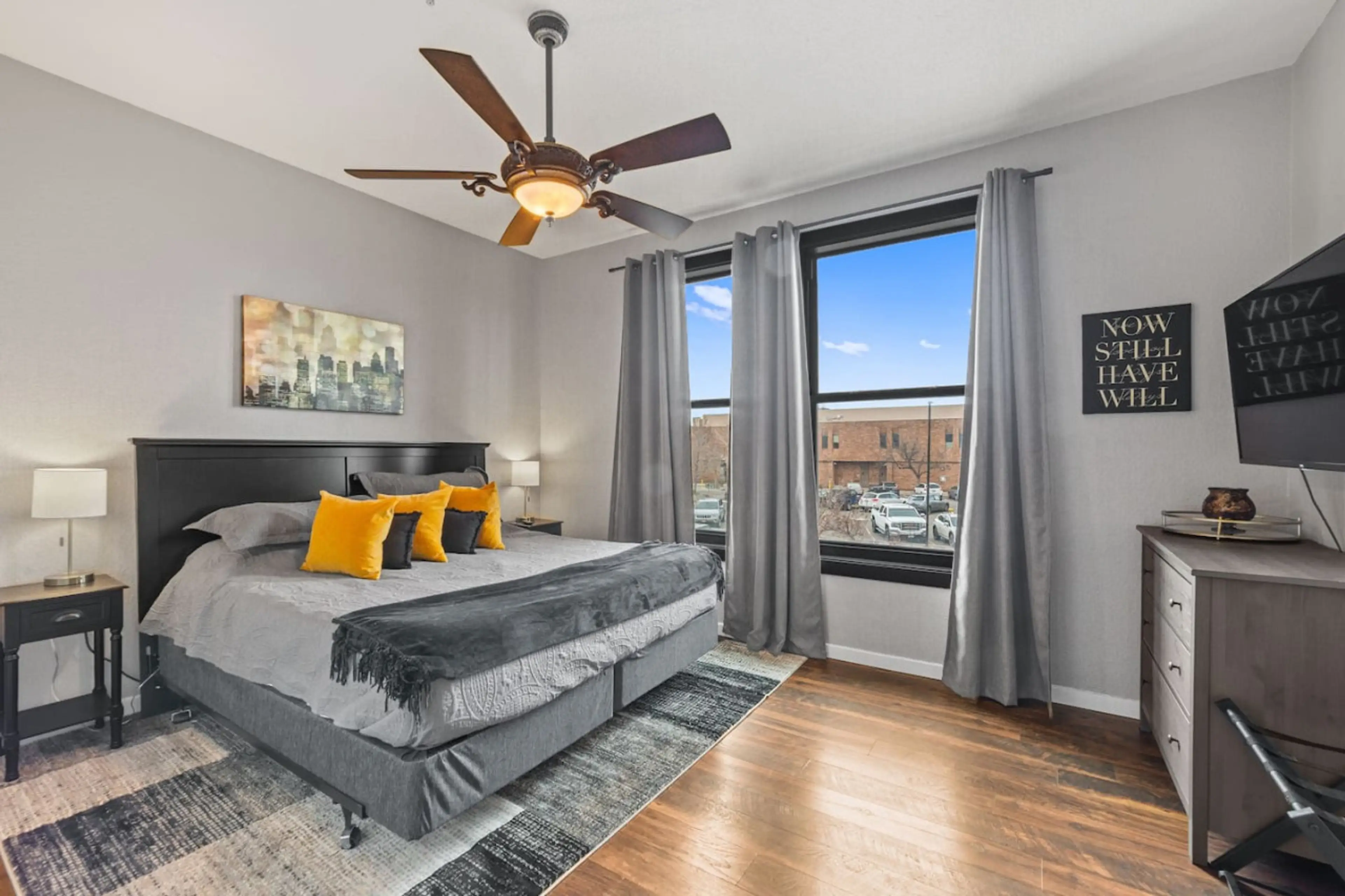 Spacious primary suite with large windows and natural light