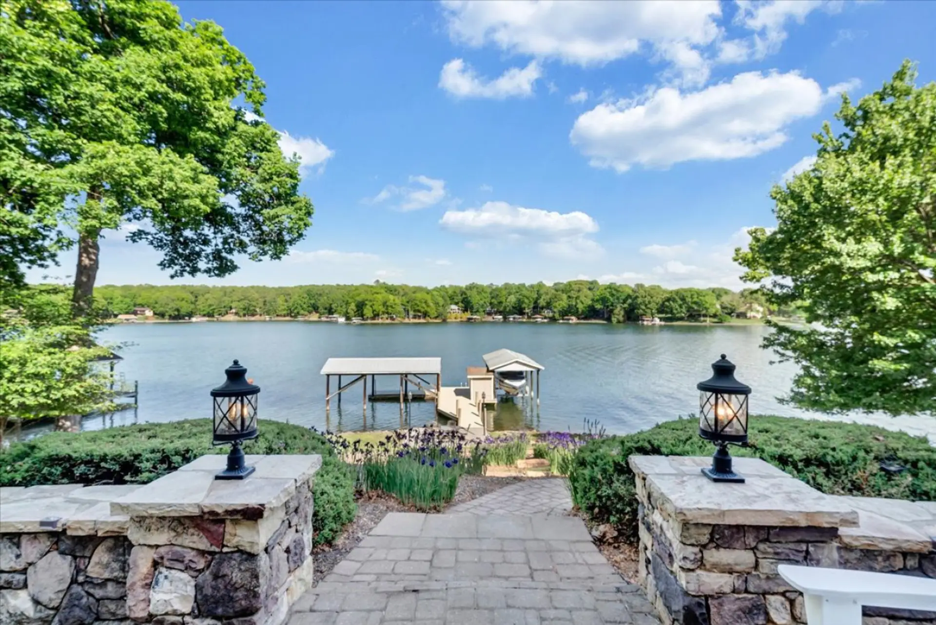 Step off the stone patio to a path to the dock