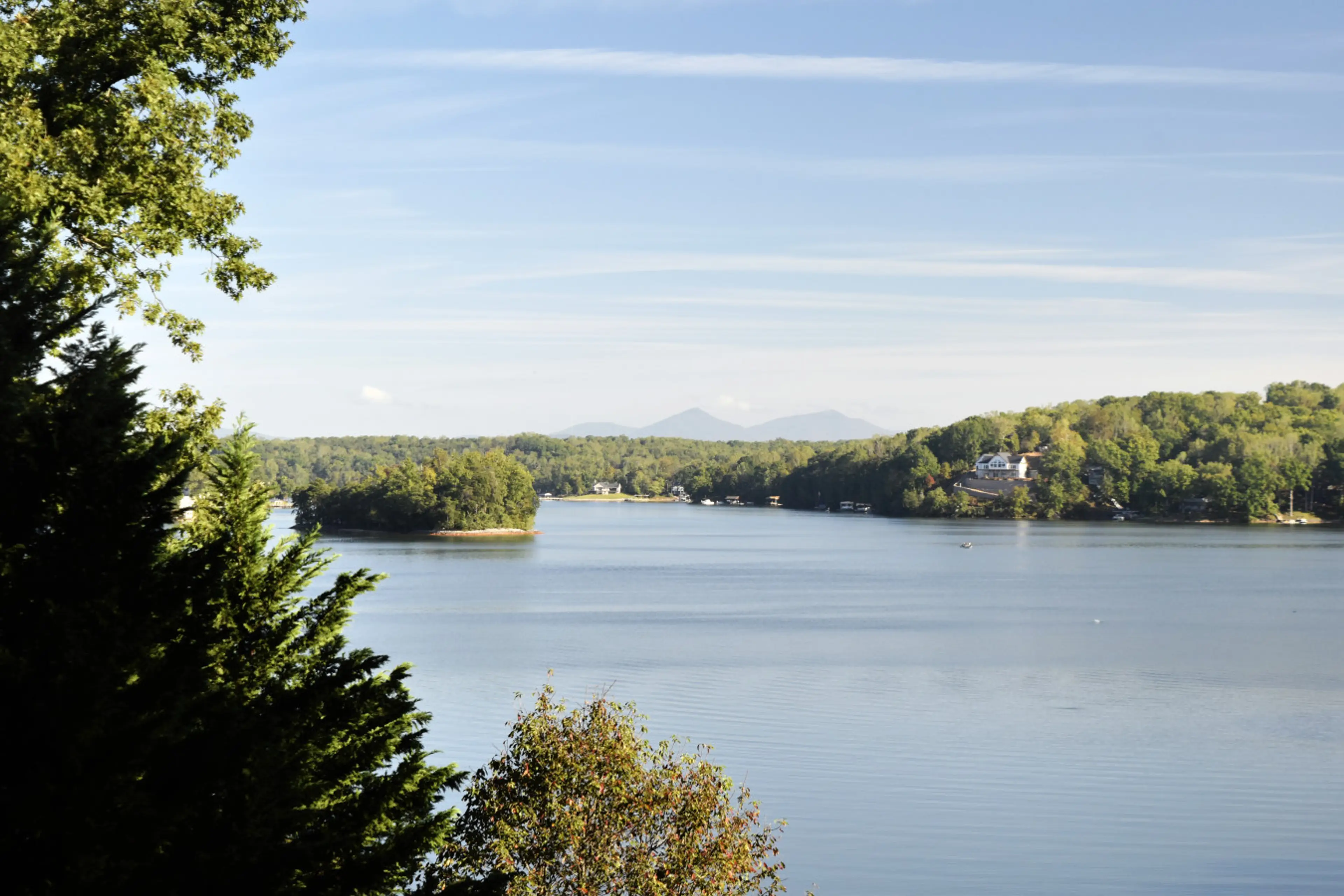 Enjoy sunsets over Smith Mountain Lake with Peaks of Otter and Betty's Island views