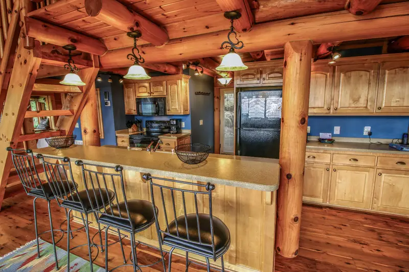 Fully equipped kitchen with island seating for four