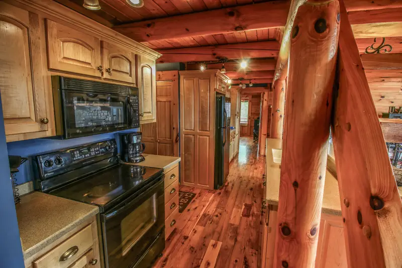 Kitchen with labeled cabinets, dishwasher, and both a Keurig and a standard coffee maker