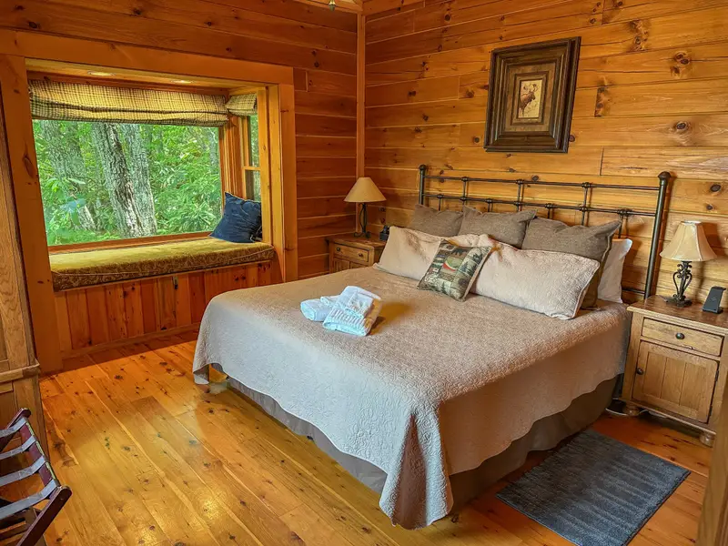 Primary king bedroom with reading nook and ensuite bath