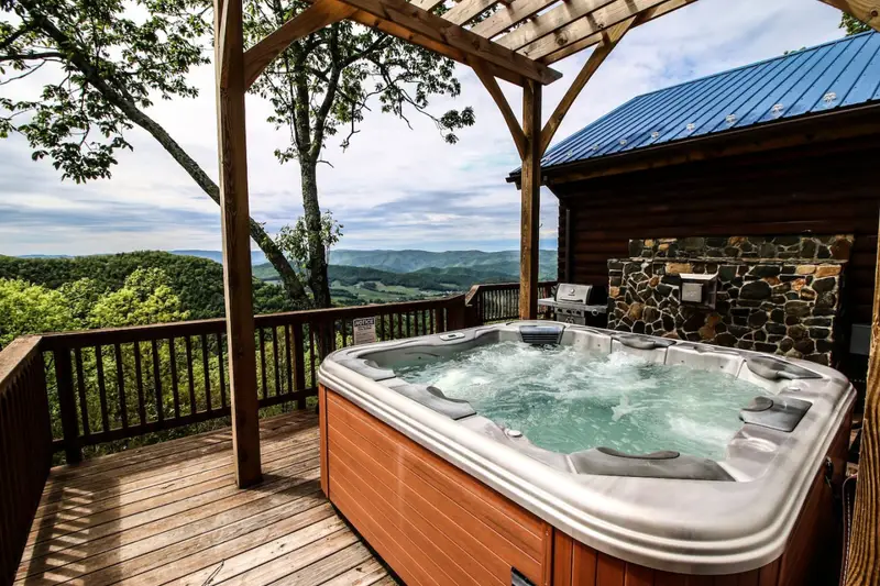 Luxury hot tub under the pergola with long-range mountain views