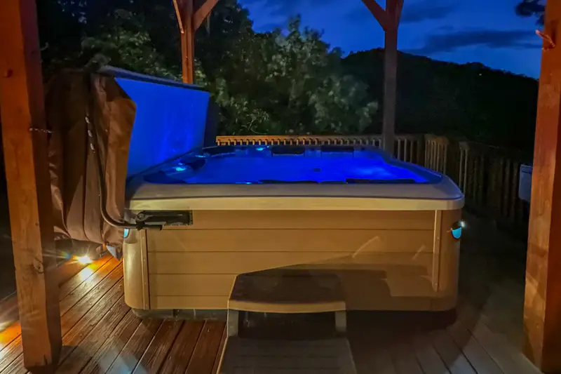 Hot tub lit up for evening stargazing