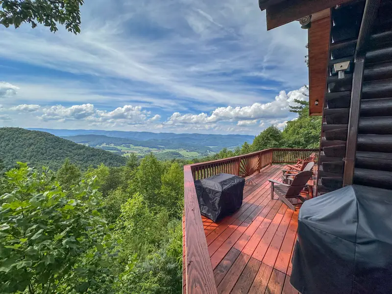 Gas grill and outdoor seating on the deck